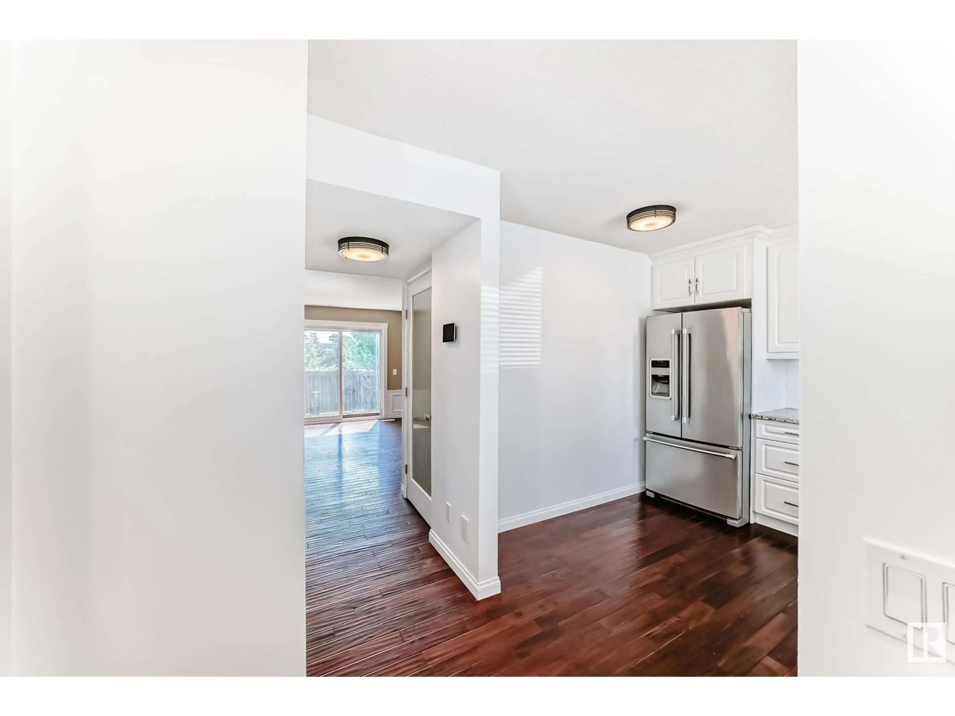 Open concept kitchen, wood/laminate floor for 18008 93 AV, Edmonton Alberta T5T1Y1