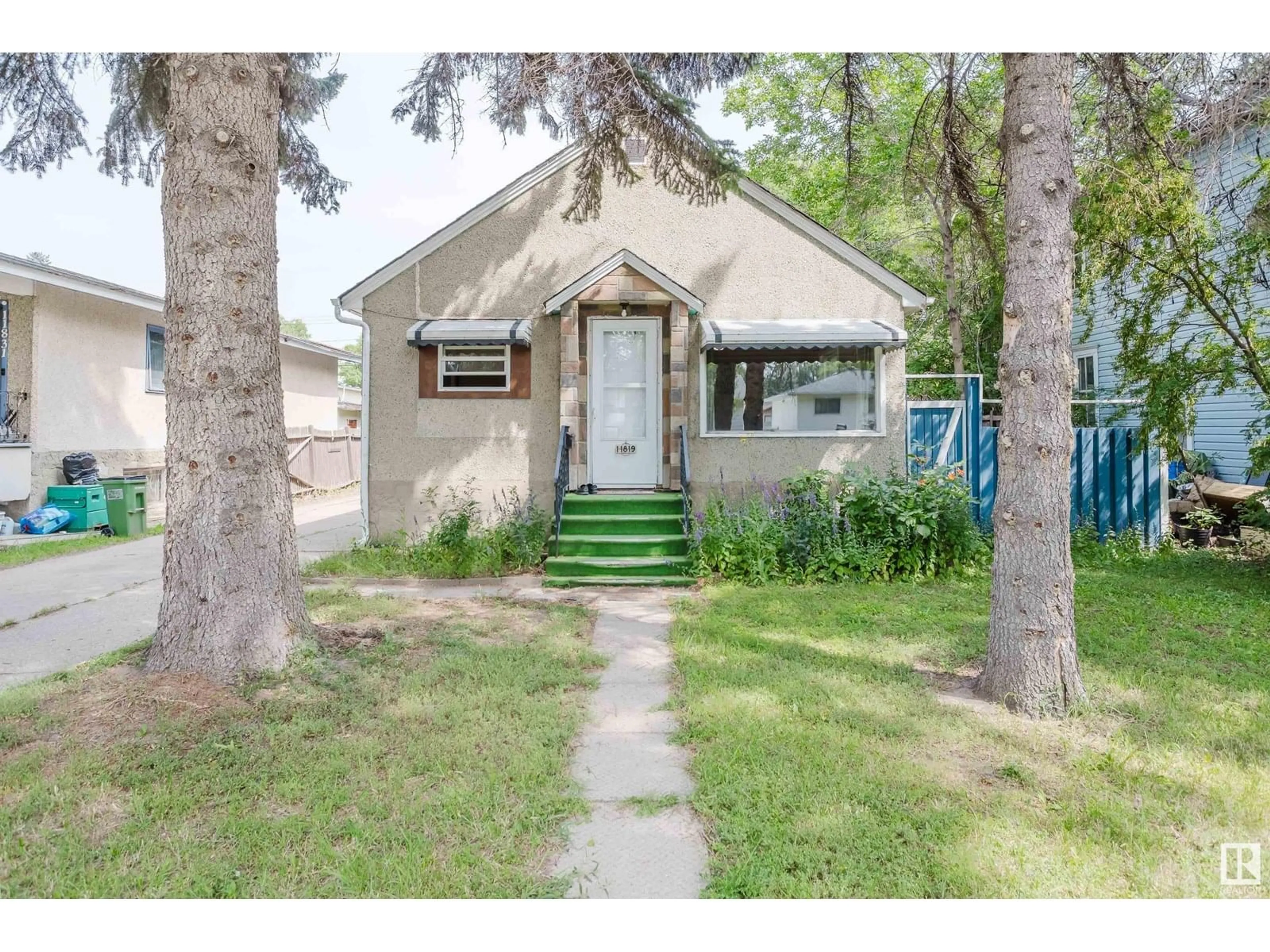 Home with vinyl exterior material, street for NW - 11819 45 ST, Edmonton Alberta T5W2T3