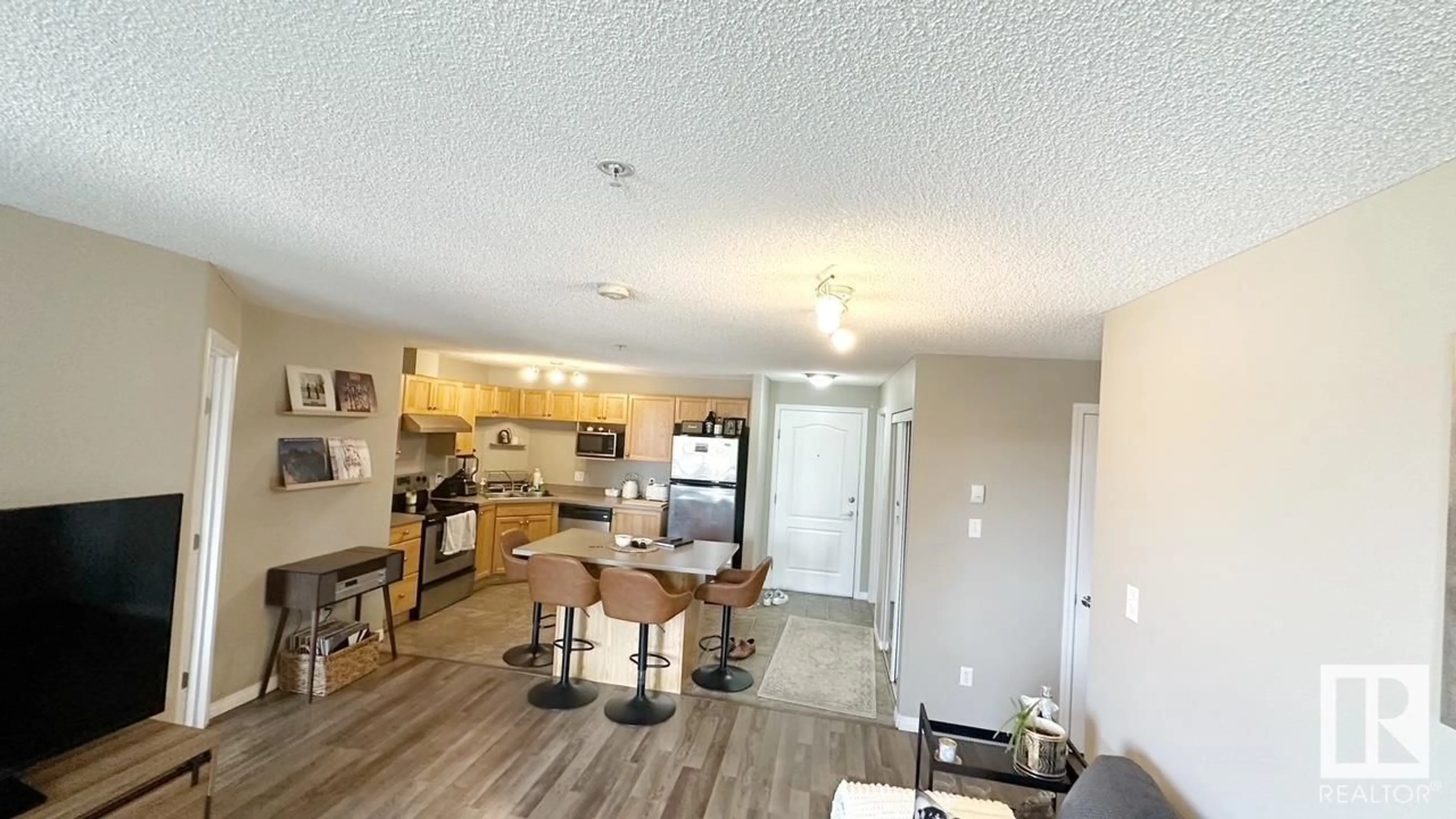 Open concept kitchen, wood/laminate floor for 9363 - 1112 SIMPSON DR, Edmonton Alberta T6R0N2