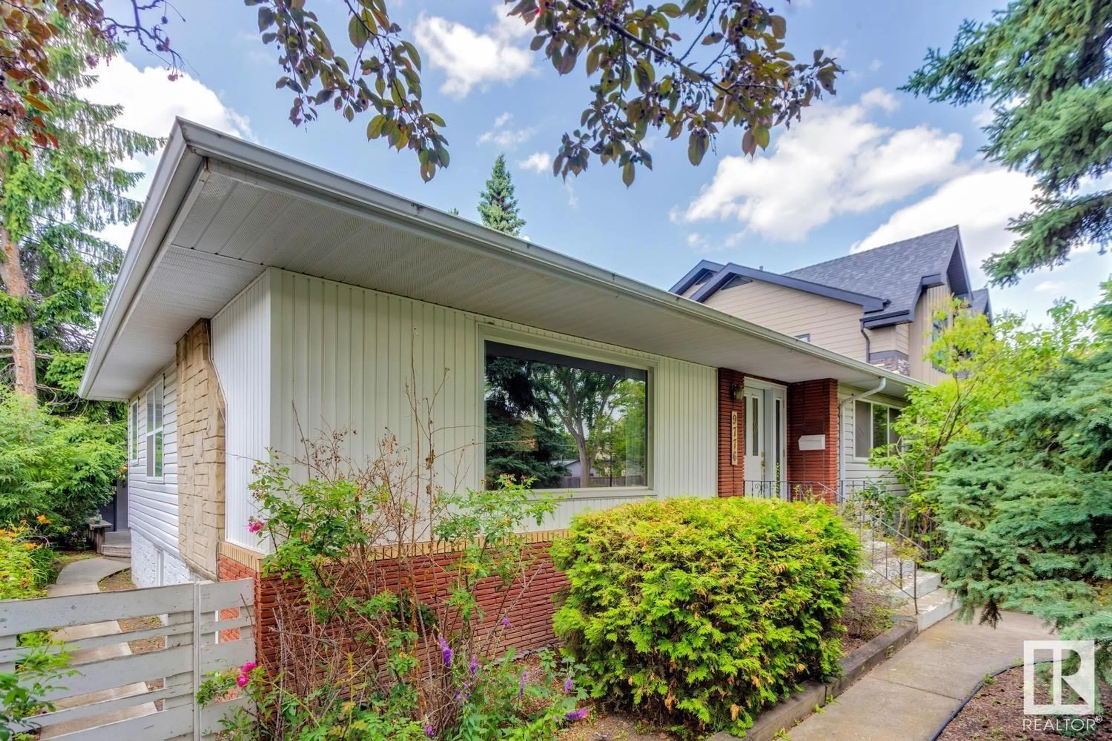Home with brick exterior material, street for 9776 146 ST, Edmonton Alberta T5N2Z4