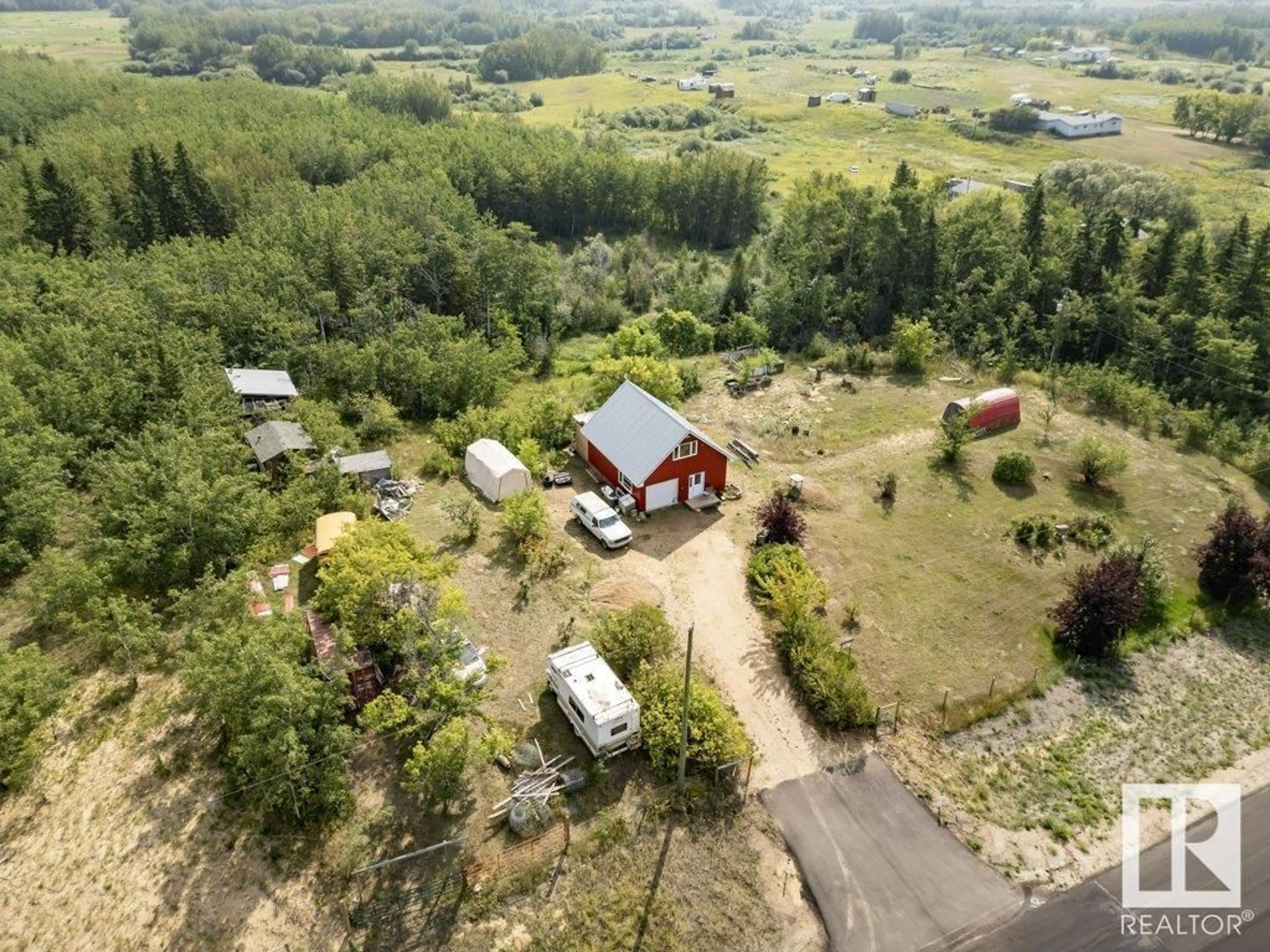 A pic from outside/outdoor area/front of a property/back of a property/a pic from drone, unknown for 57023 RR 220, Rural Sturgeon County Alberta T0A2W0