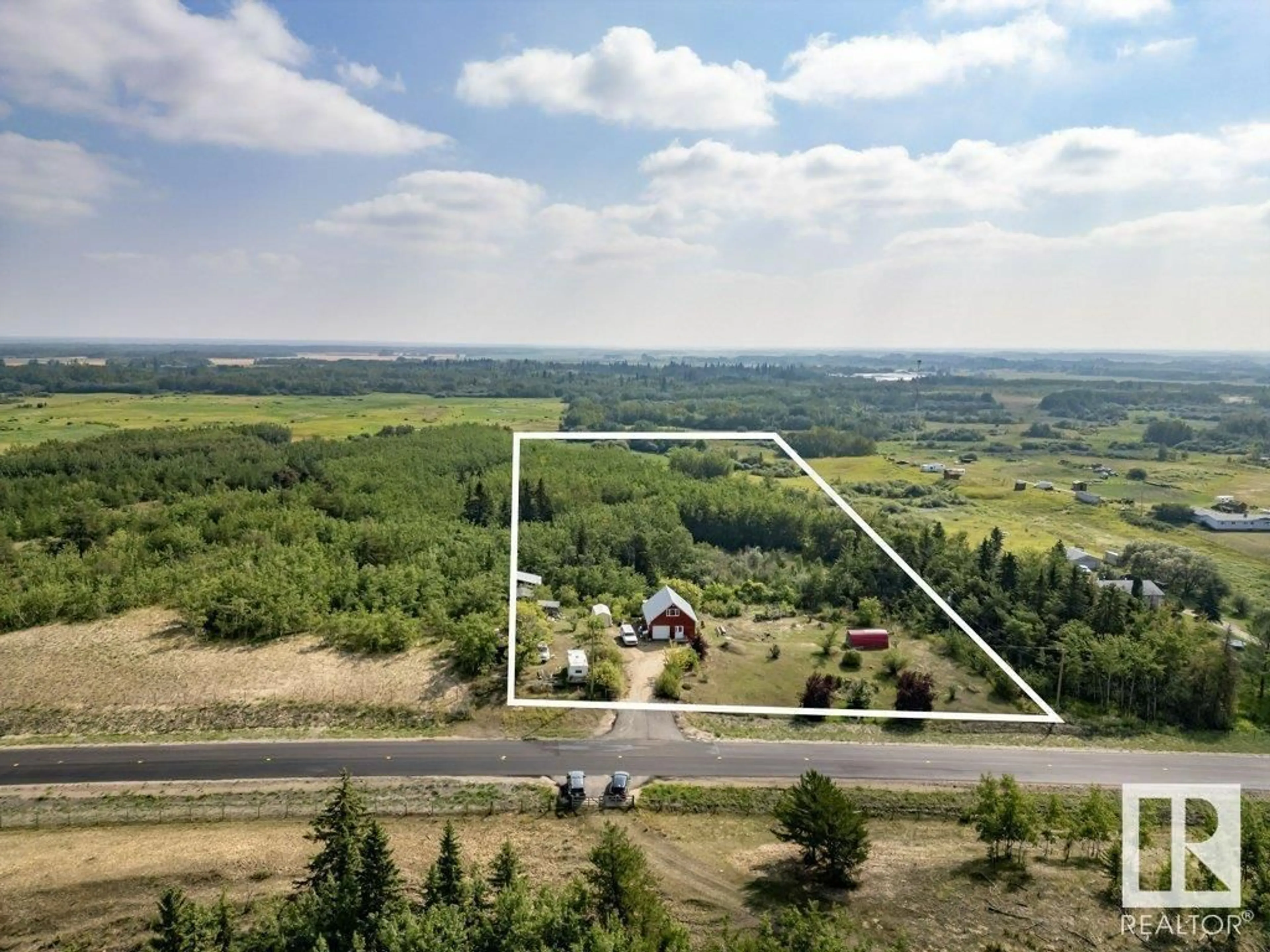A pic from outside/outdoor area/front of a property/back of a property/a pic from drone, unknown for 57023 RR 220, Rural Sturgeon County Alberta T0A2W0
