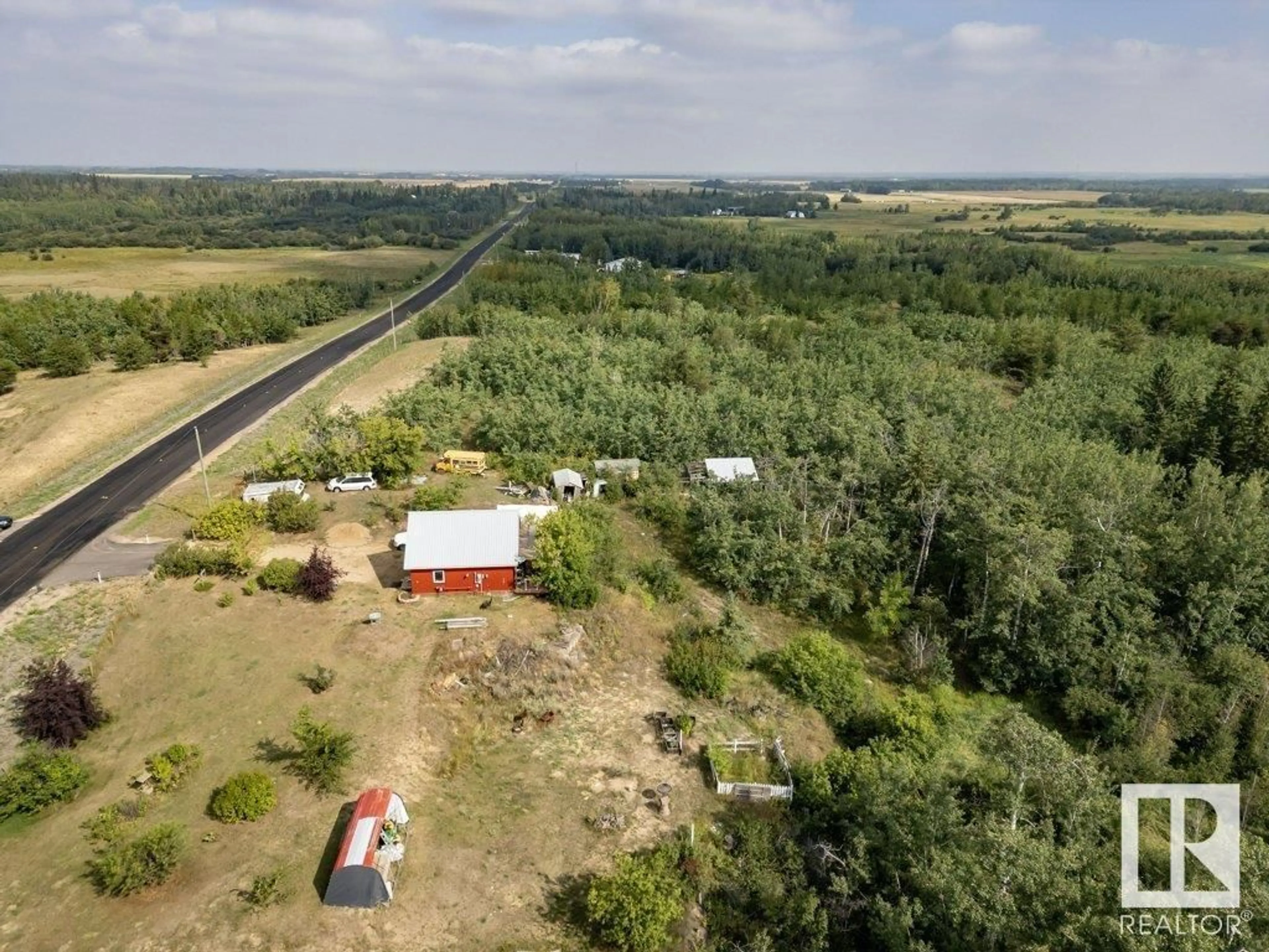 A pic from outside/outdoor area/front of a property/back of a property/a pic from drone, forest/trees view for 57023 RR 220, Rural Sturgeon County Alberta T0A2W0