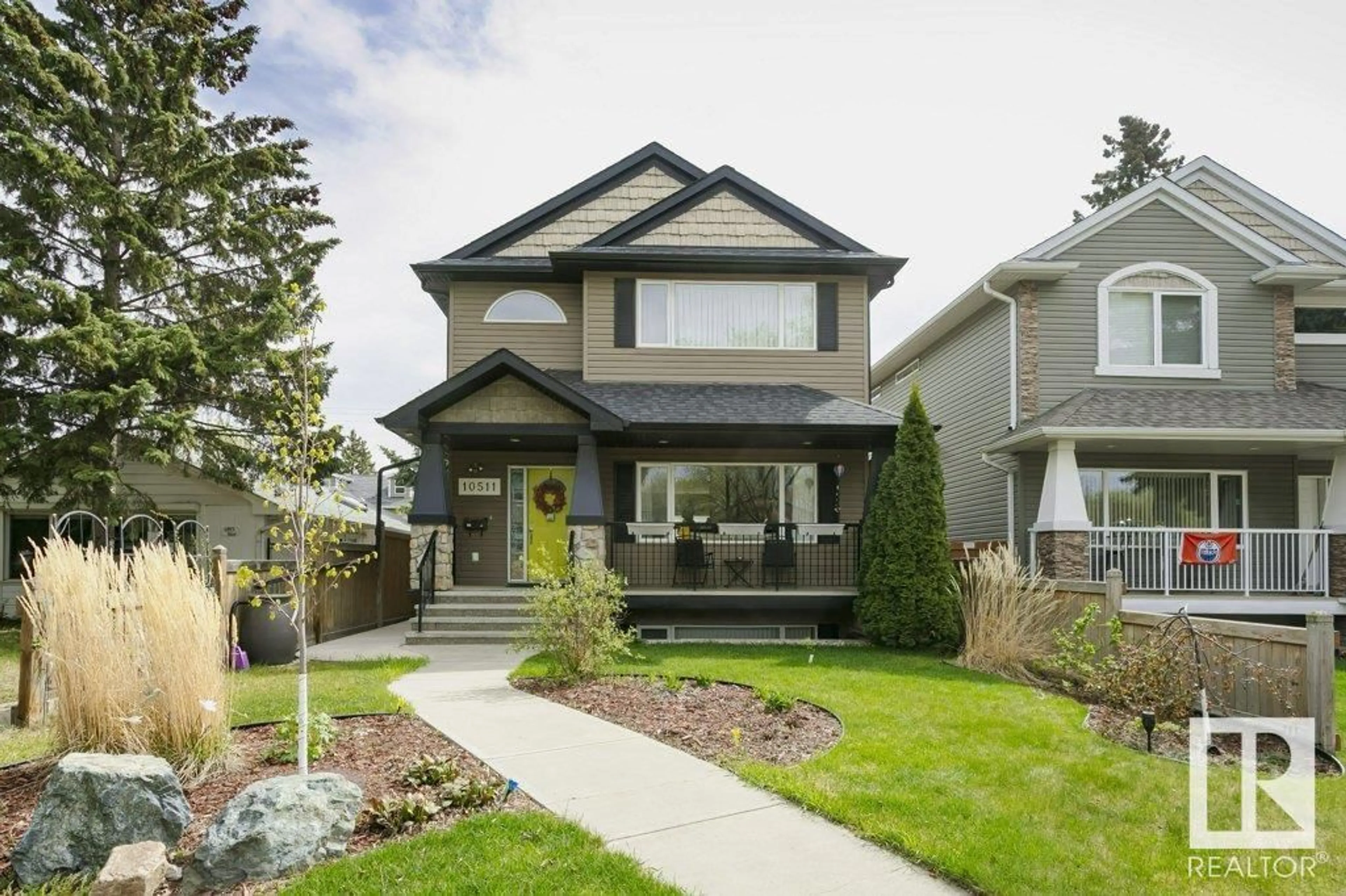 Home with vinyl exterior material, street for NW - 10511 76 ST, Edmonton Alberta T6A3B2