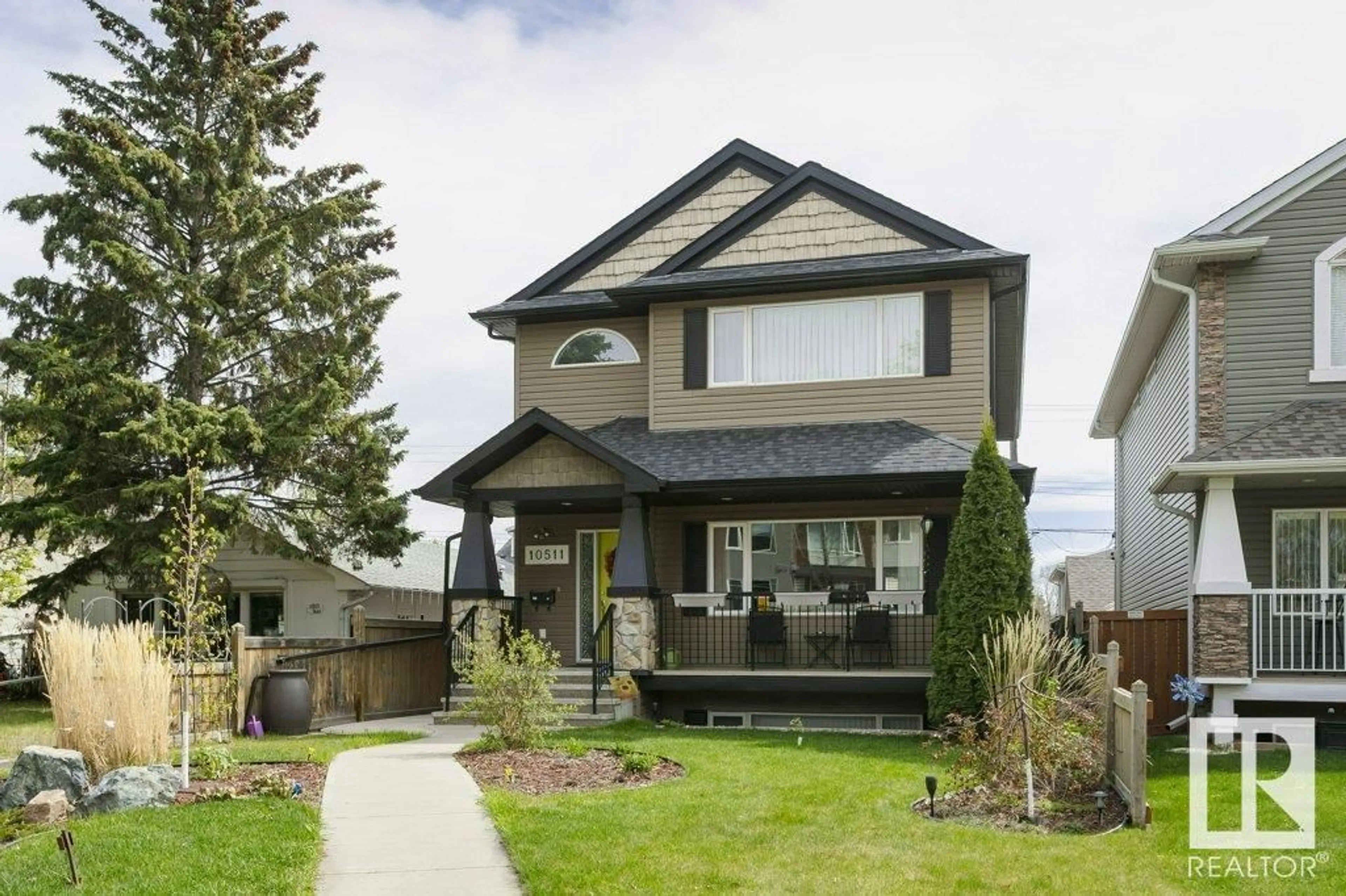 Home with vinyl exterior material, street for NW - 10511 76 ST, Edmonton Alberta T6A3B2