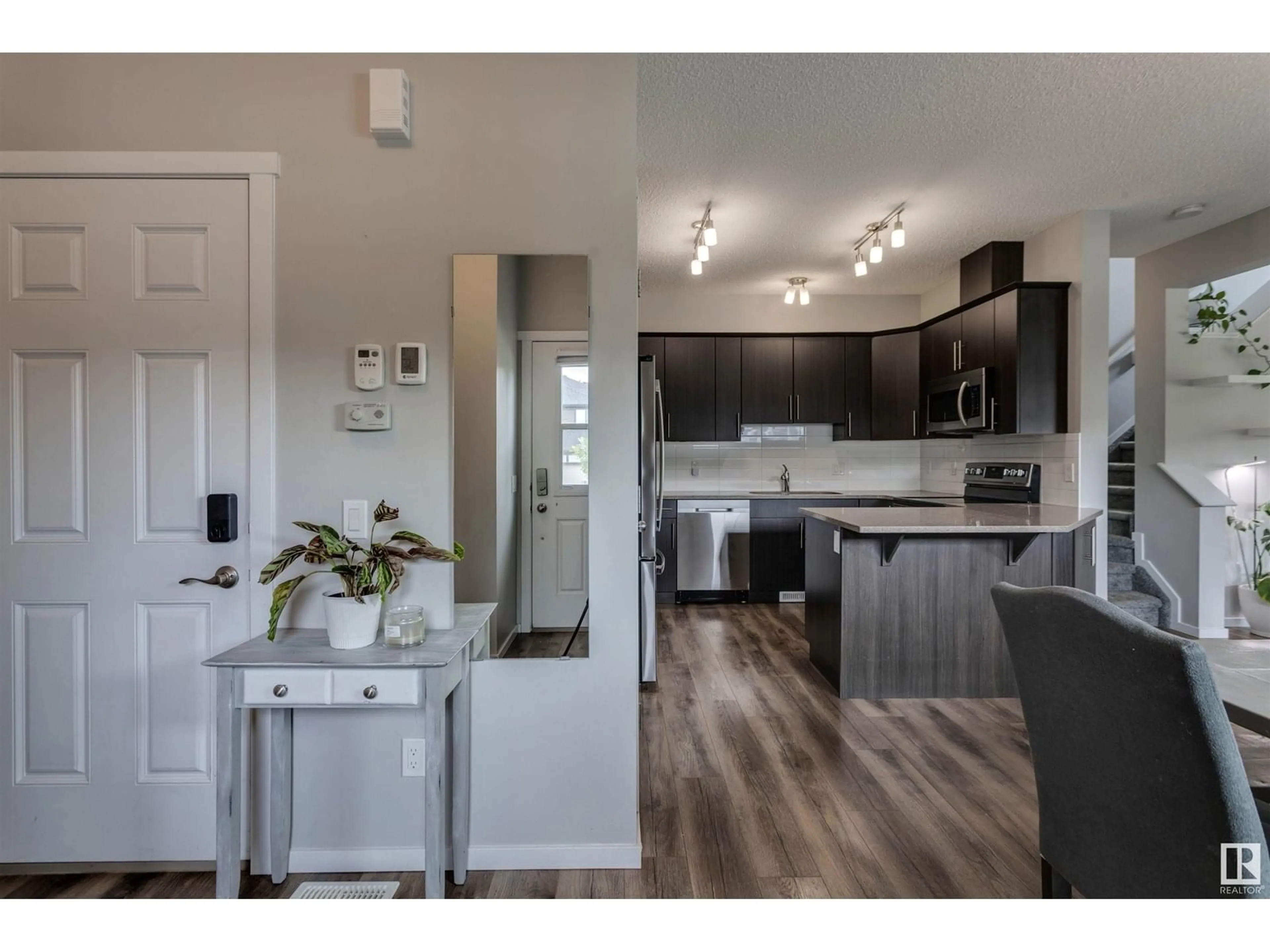 Open concept kitchen, wood/laminate floor for 206 ABERDEEN CR, Sherwood Park Alberta T8H0Z1