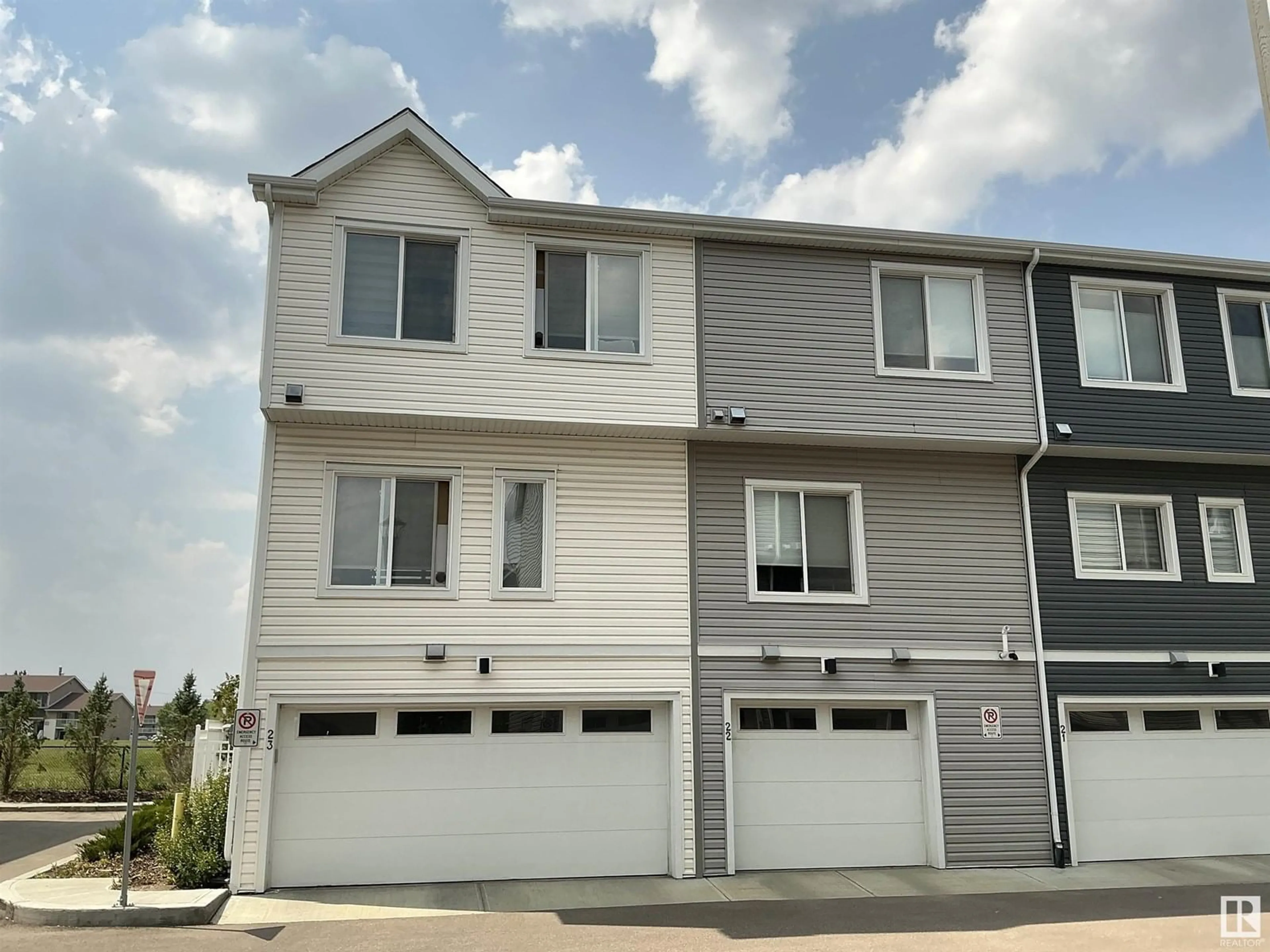 Home with vinyl exterior material, street for 22 215 SADDLEBACK RD, Edmonton Alberta T6J5T6