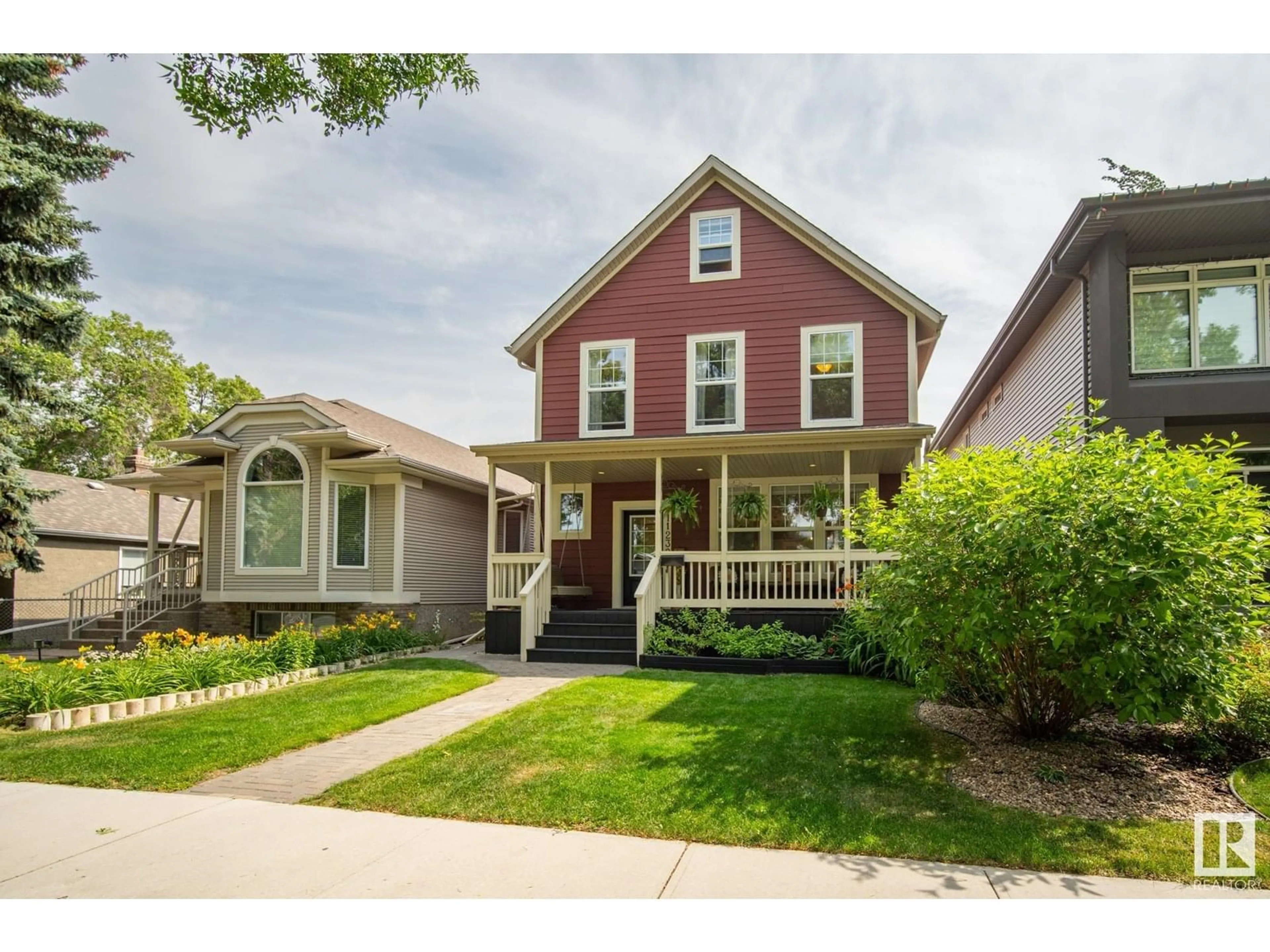 Home with vinyl exterior material, street for NW - 11239 67 ST, Edmonton Alberta T5B1K9