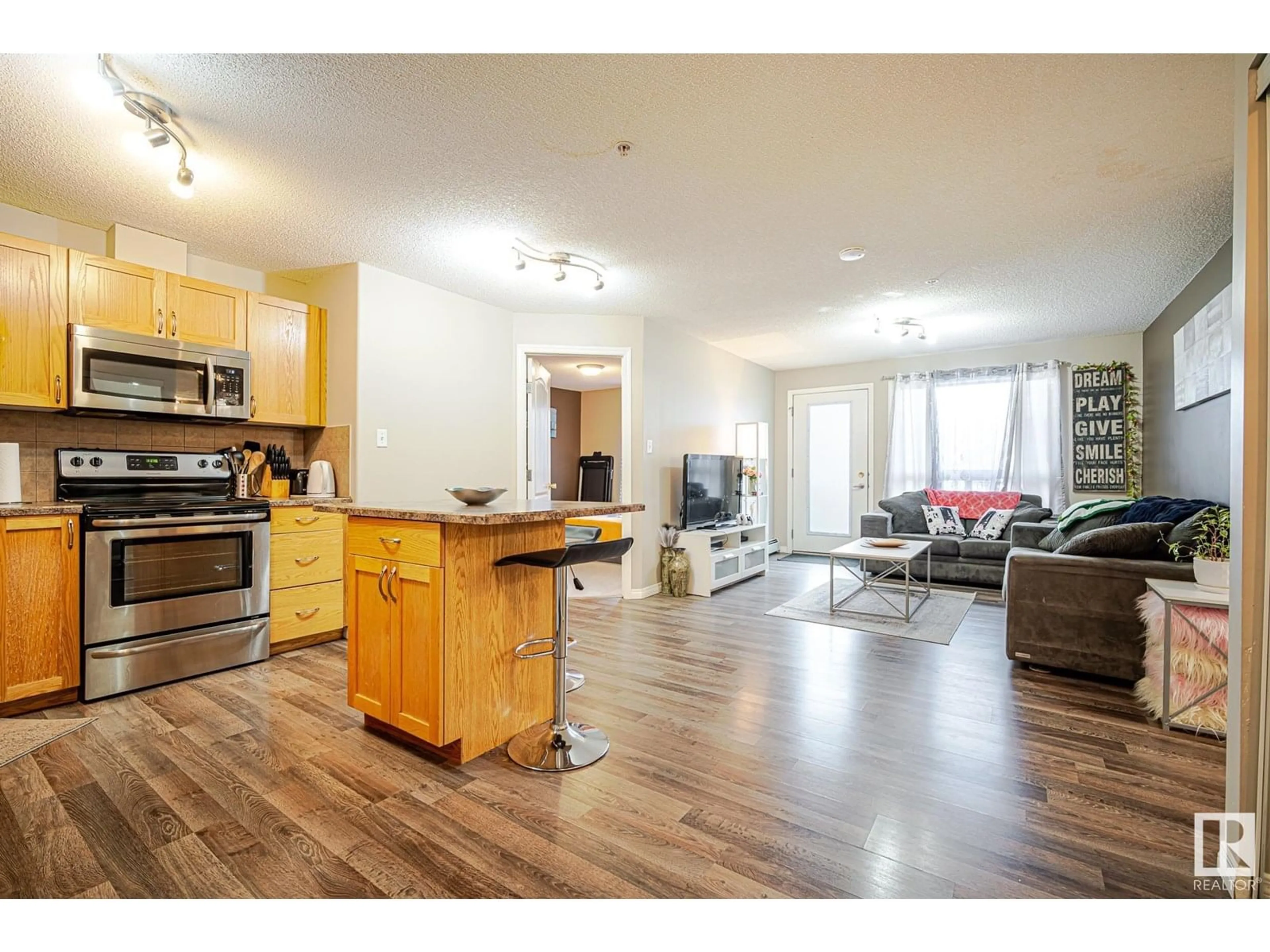 Open concept kitchen, wood/laminate floor for #1124 - 1124 CLAREVIEW STATION DR, Edmonton Alberta T5Y0E6