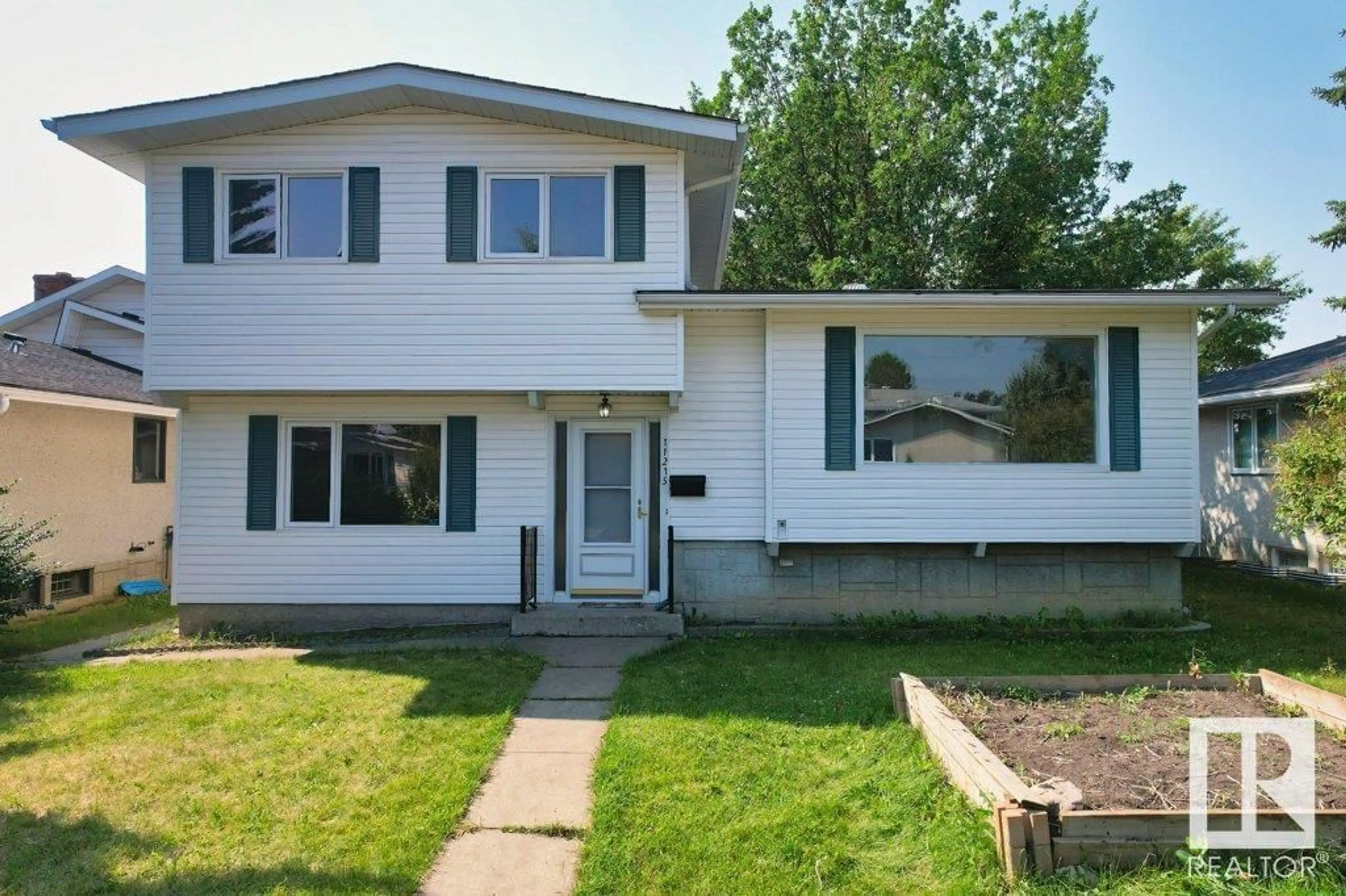 Home with vinyl exterior material, street for 11215 35A AV, Edmonton Alberta T6J0A7
