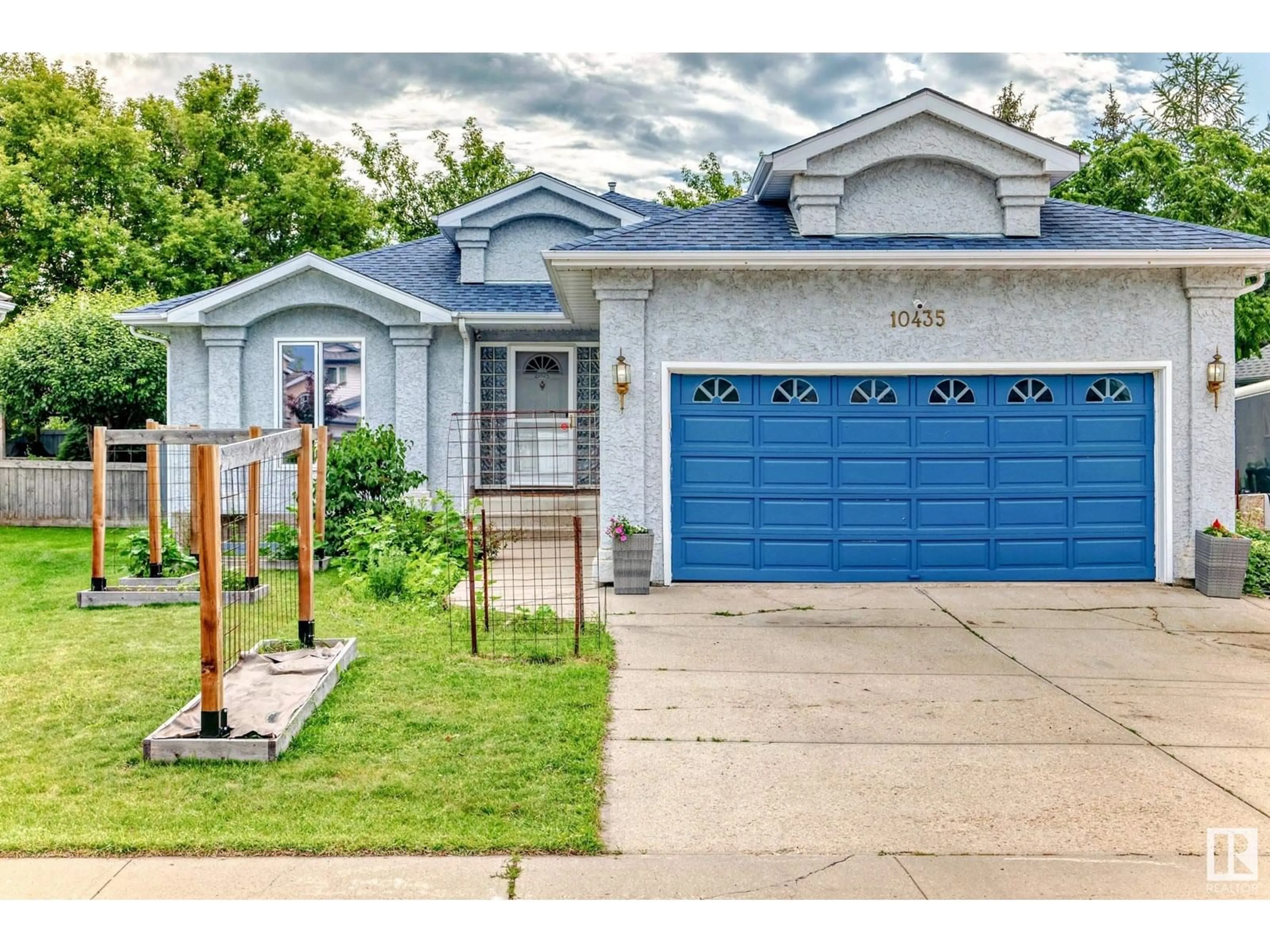 Home with vinyl exterior material, street for 10435 175A AV, Edmonton Alberta T5X5X1