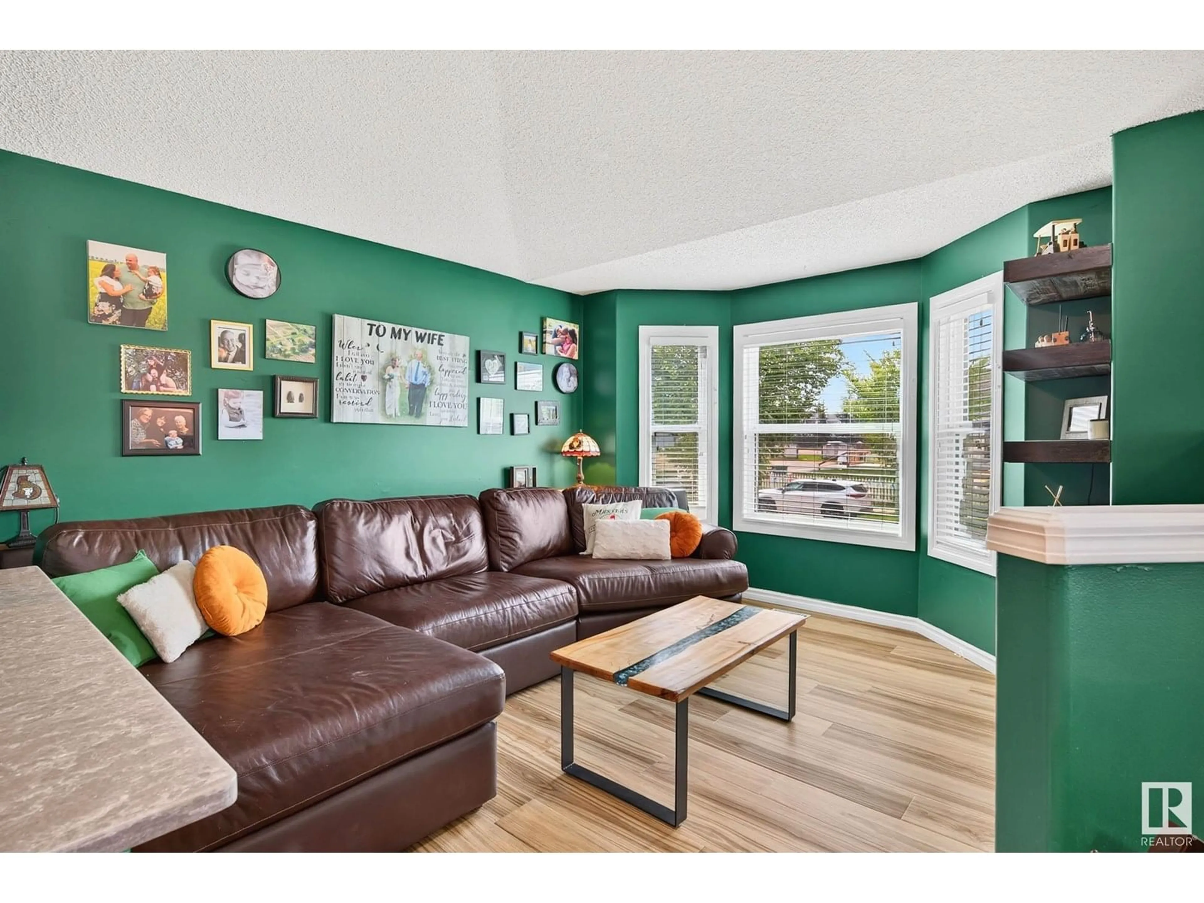 Living room with furniture, wood/laminate floor for 3117 49 ST, Beaumont Alberta T4X1R6