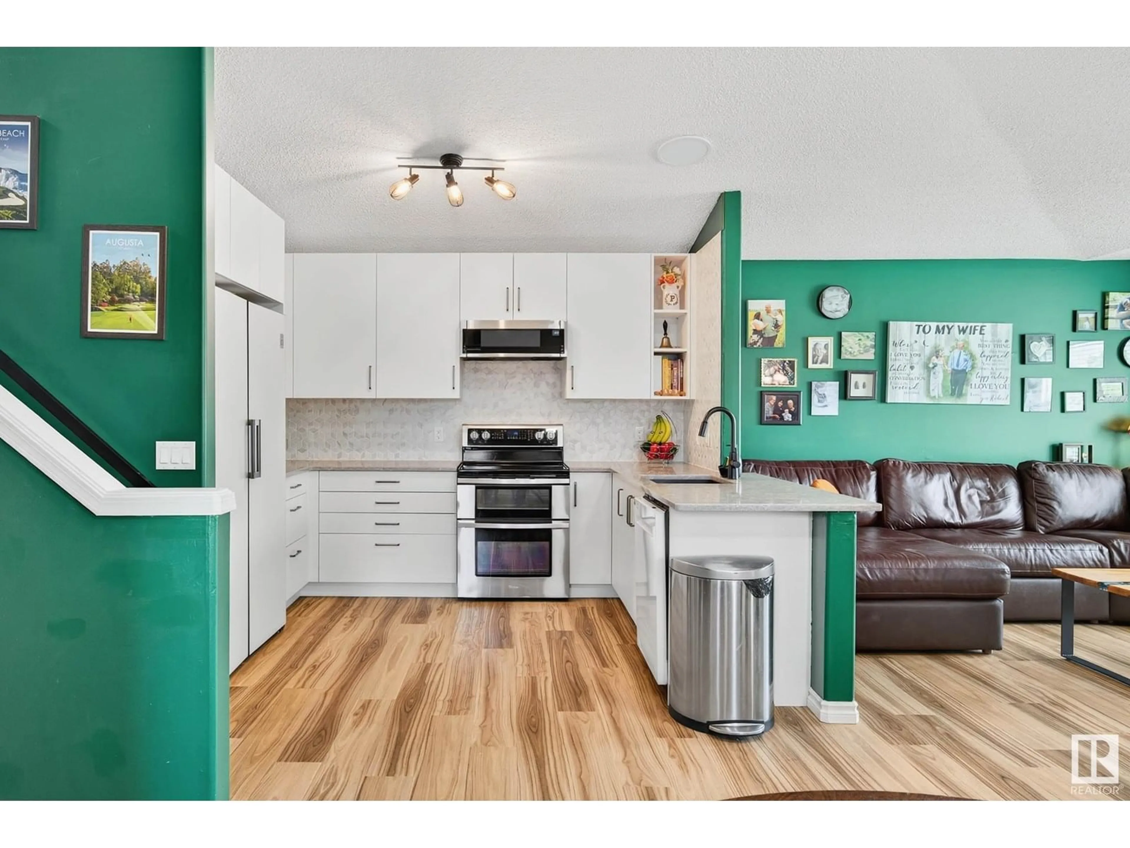 Open concept kitchen, wood/laminate floor for 3117 49 ST, Beaumont Alberta T4X1R6