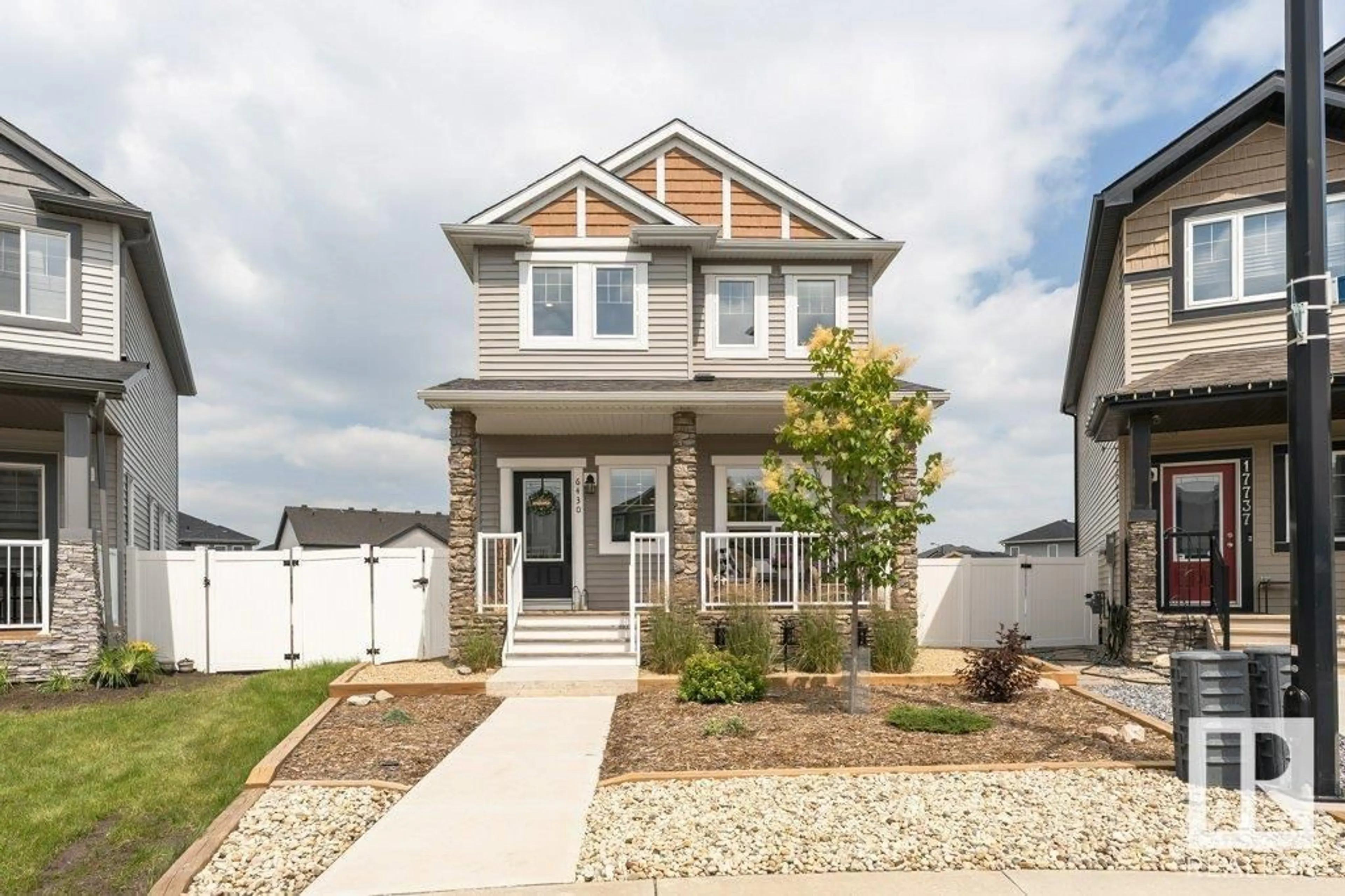 Home with vinyl exterior material, street for 6430 177A AV, Edmonton Alberta T5Y3X4