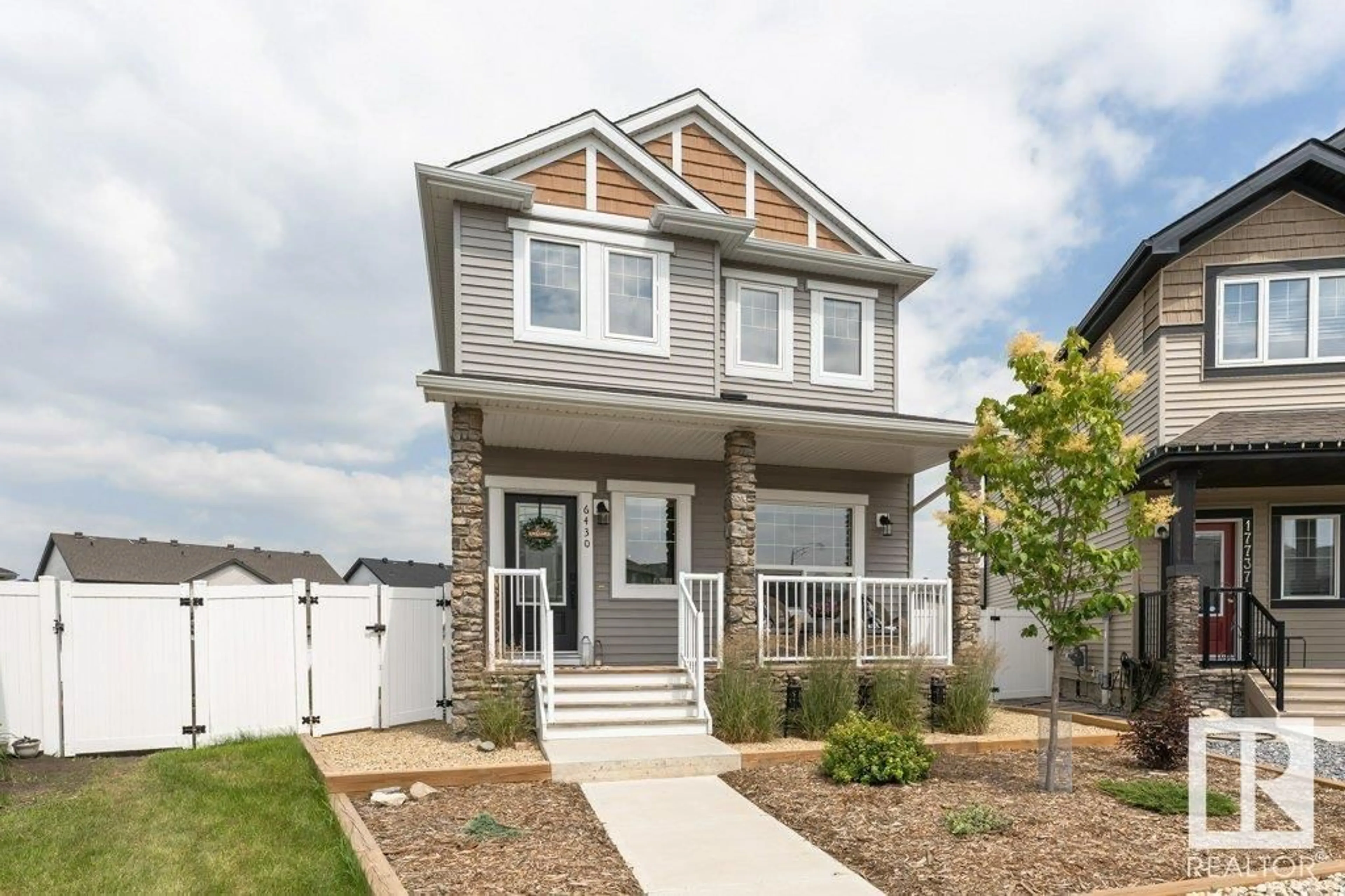 Home with vinyl exterior material, street for 6430 177A AV, Edmonton Alberta T5Y3X4