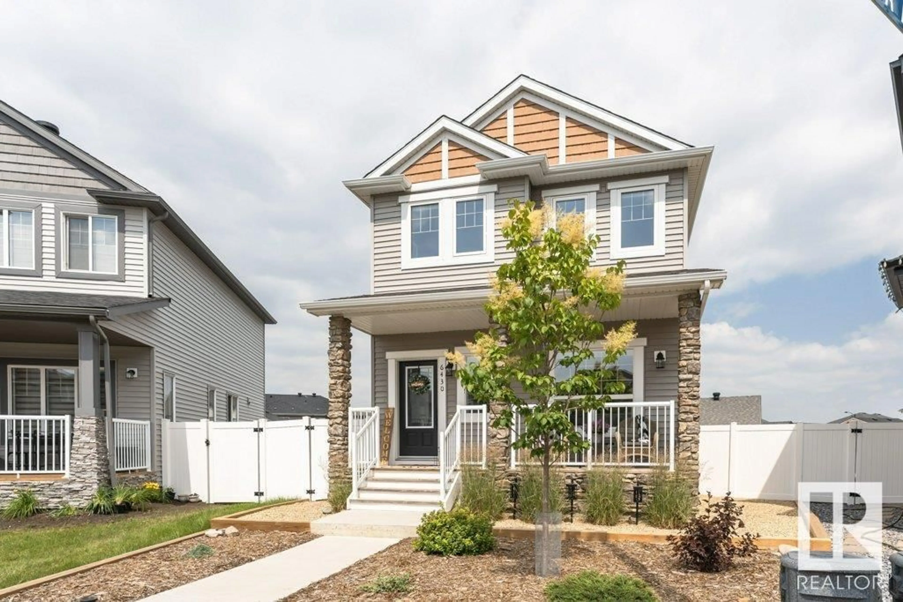 Home with vinyl exterior material, street for 6430 177A AV, Edmonton Alberta T5Y3X4