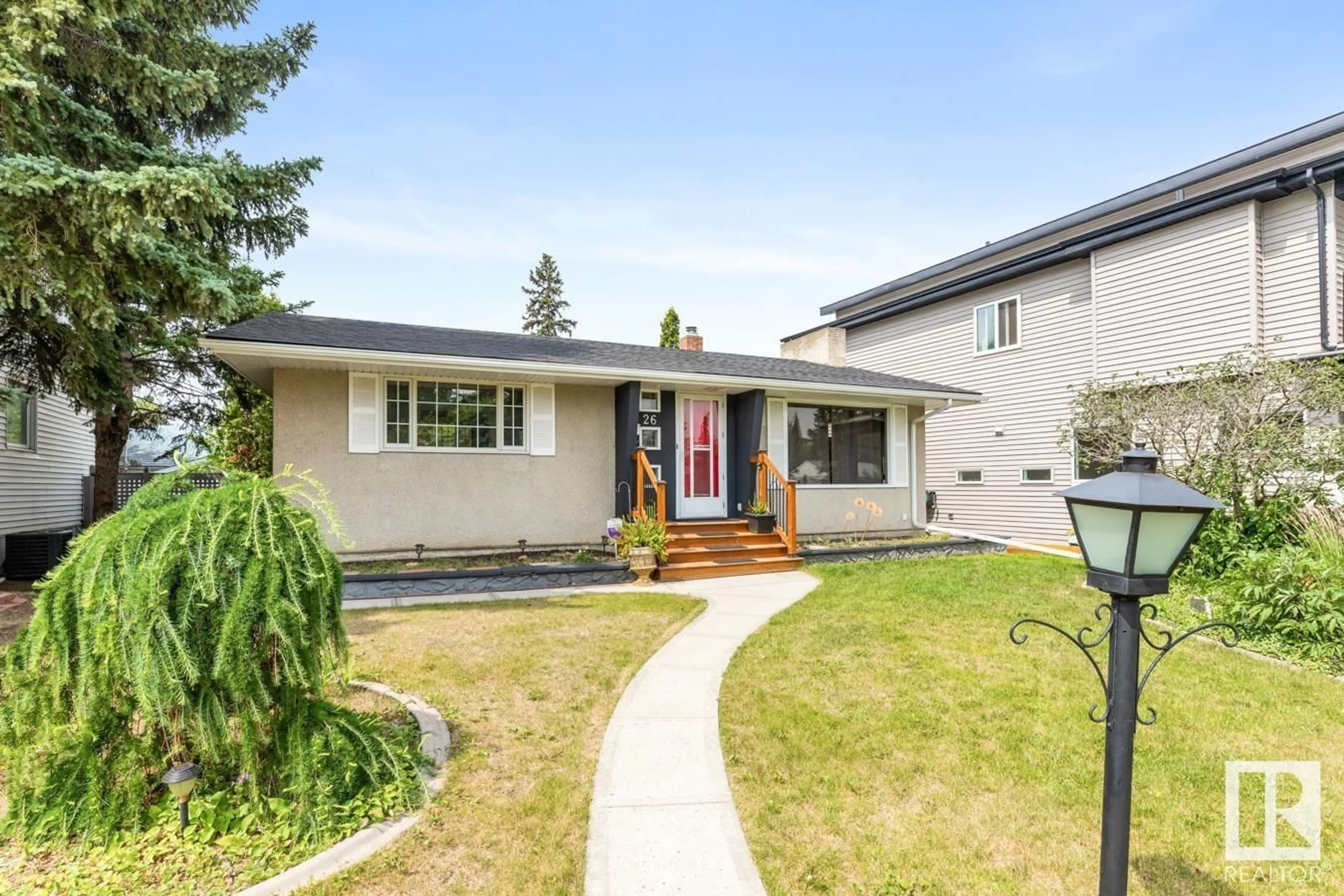 Home with vinyl exterior material, street for NW - 10926 117 ST, Edmonton Alberta T5H3N6