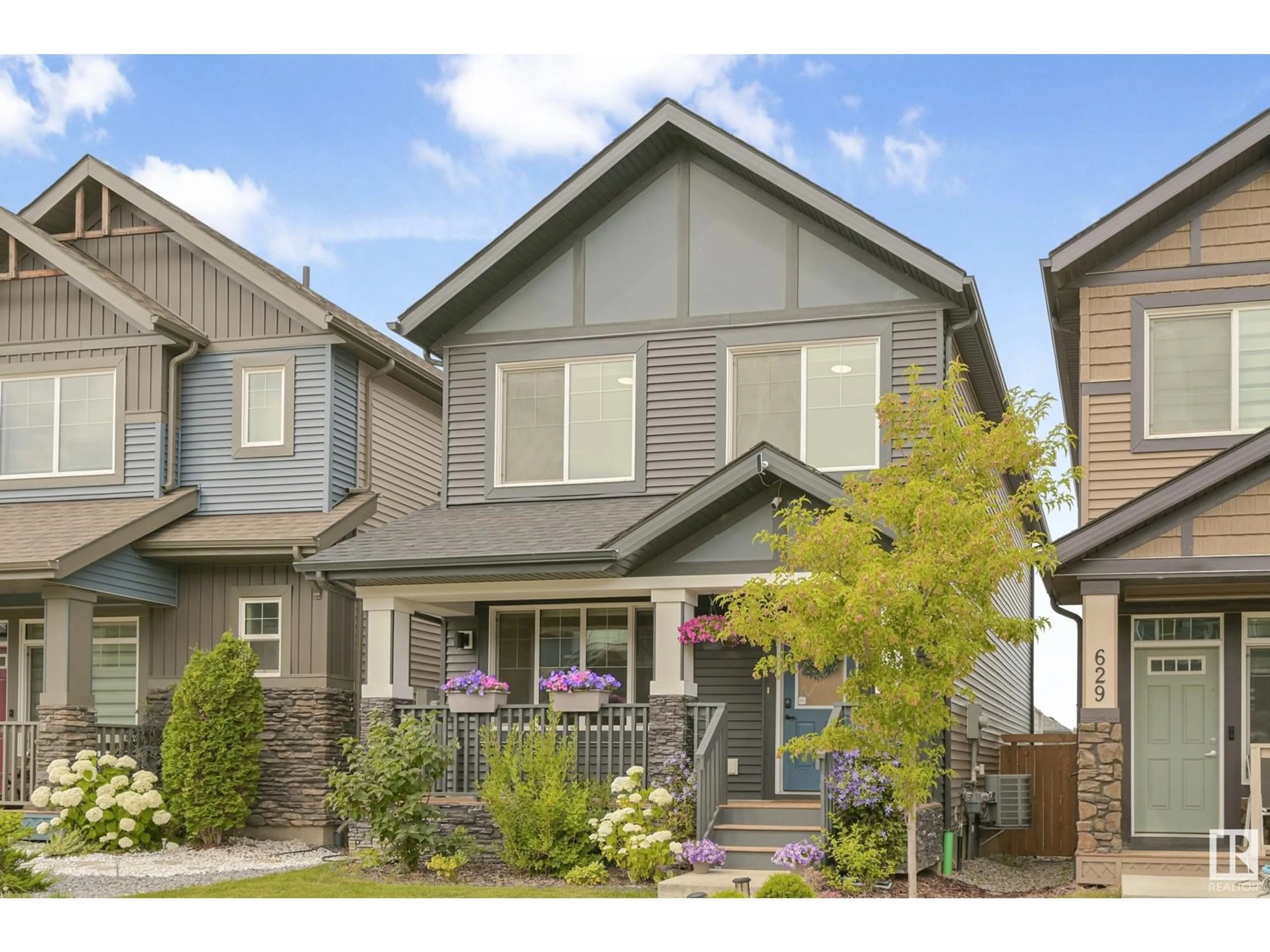Home with vinyl exterior material, street for 627 MERLIN LANDING LD, Edmonton Alberta T5S0M1