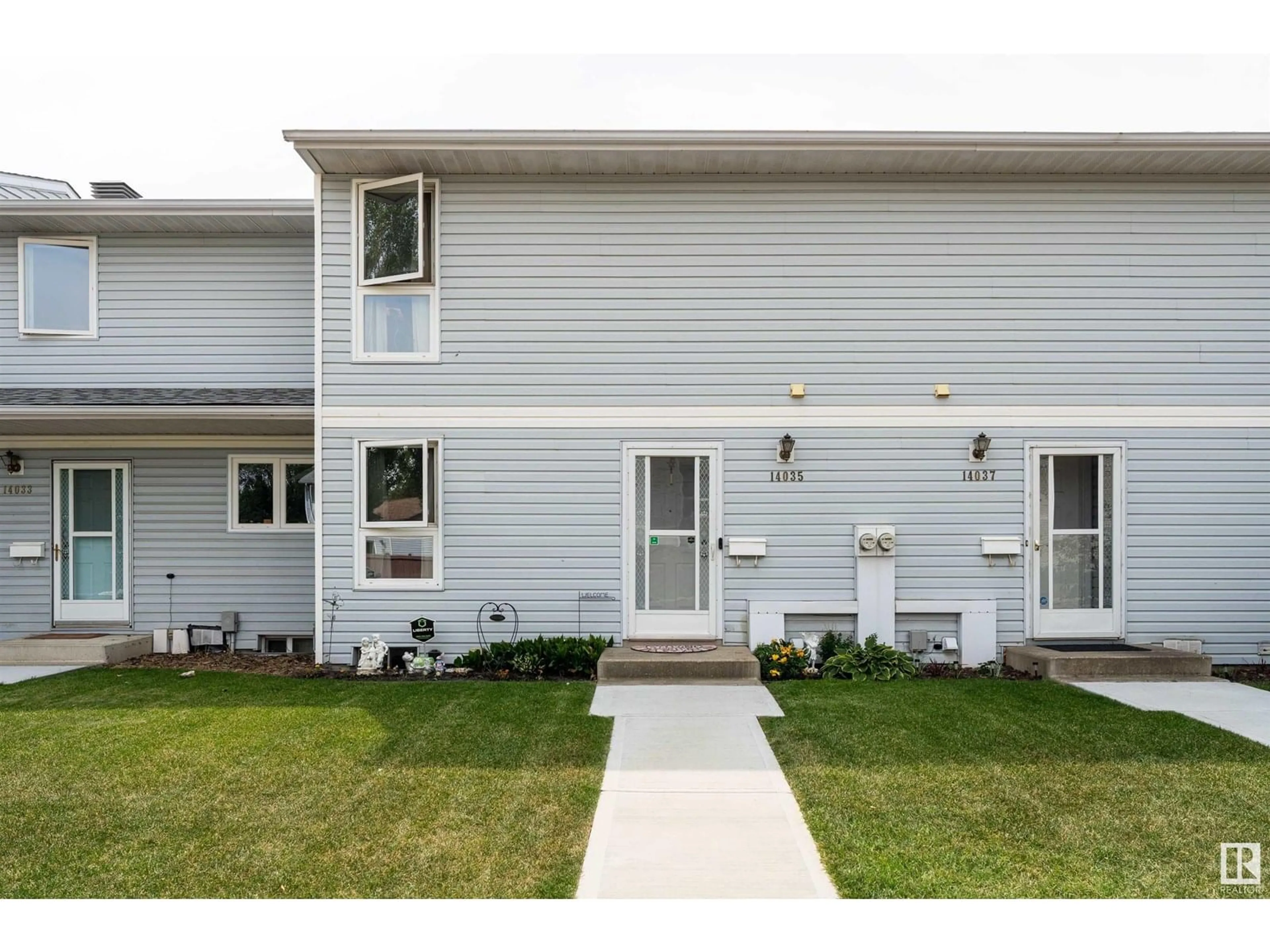 Home with vinyl exterior material, street for NW - 14035 121 ST, Edmonton Alberta T5X4H8