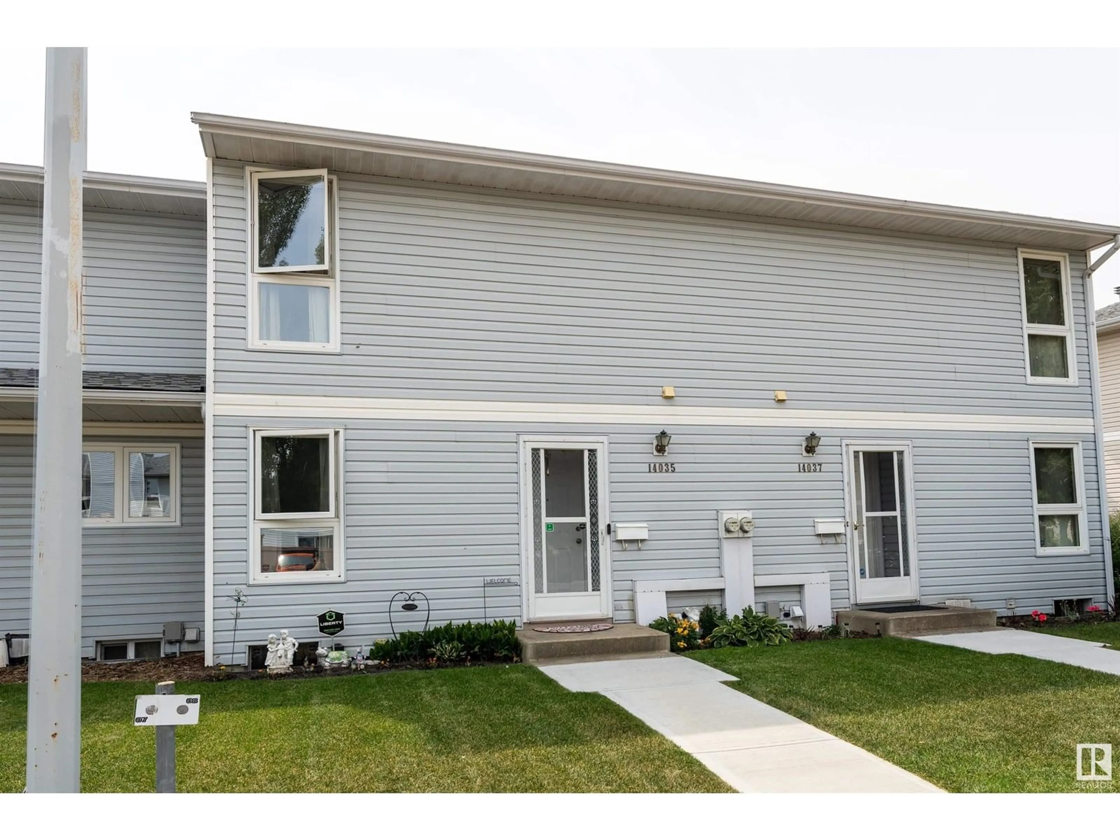 Home with vinyl exterior material, street for NW - 14035 121 ST, Edmonton Alberta T5X4H8