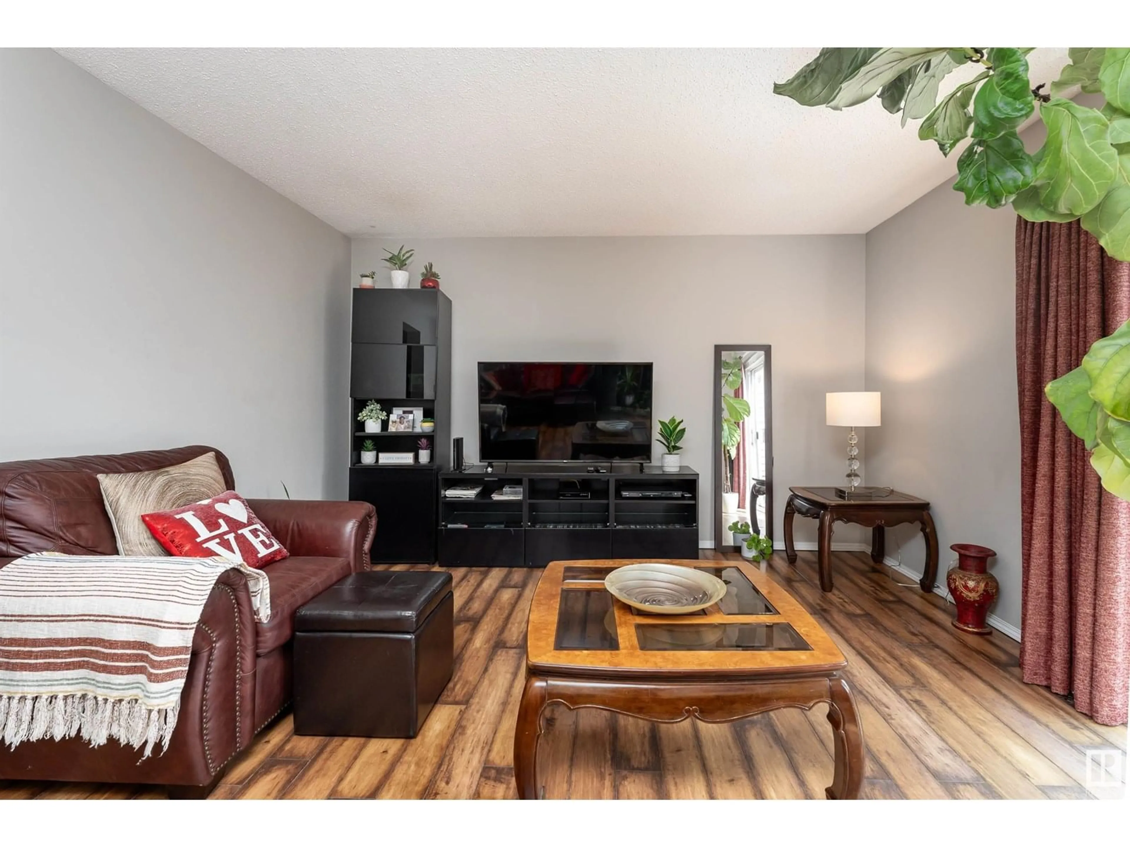 Living room with furniture, wood/laminate floor for NW - 14035 121 ST, Edmonton Alberta T5X4H8