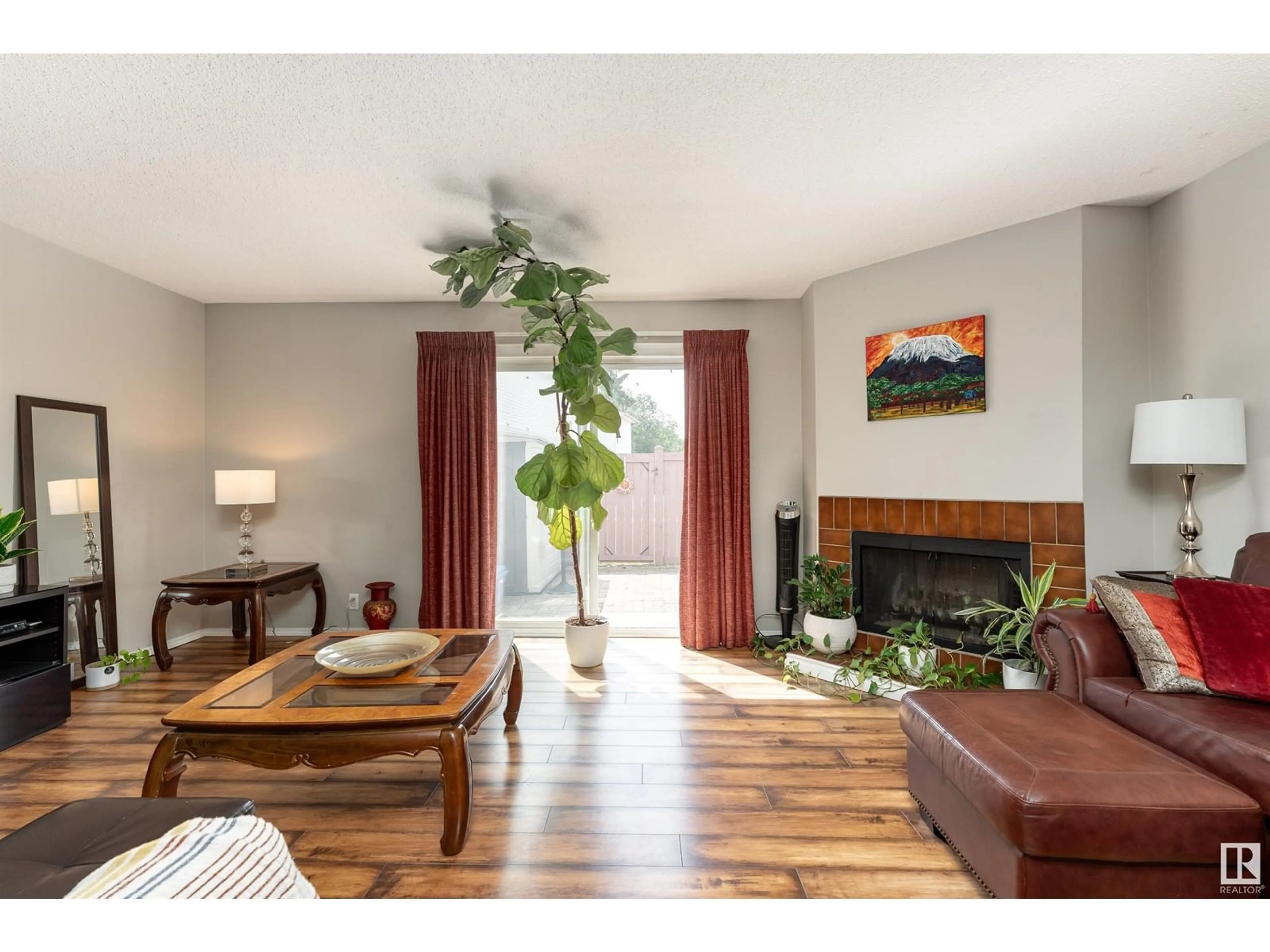 Living room with furniture, wood/laminate floor for NW - 14035 121 ST, Edmonton Alberta T5X4H8