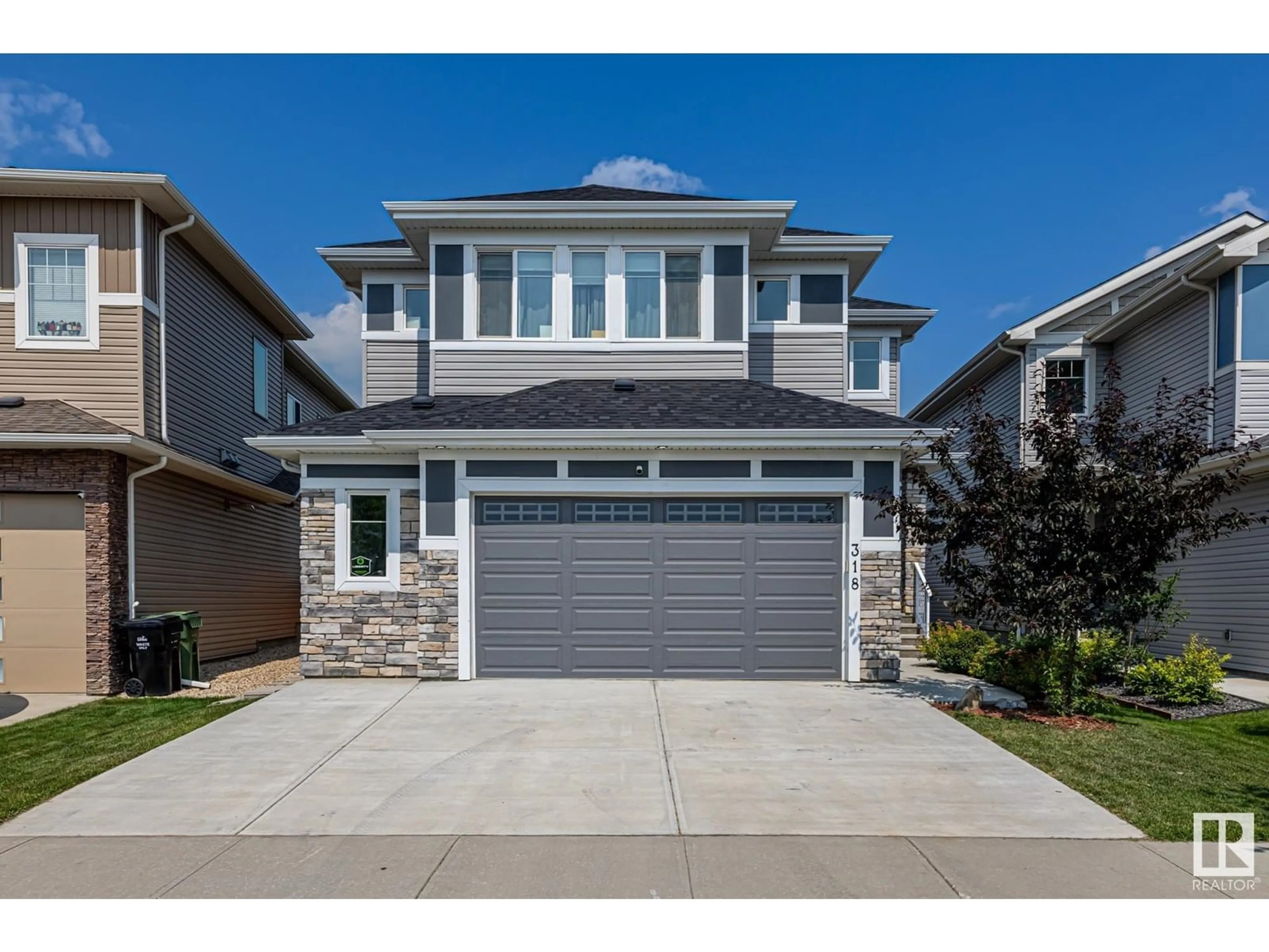 Home with vinyl exterior material, street for 318 HAVEN DR, Leduc Alberta T9E1B6