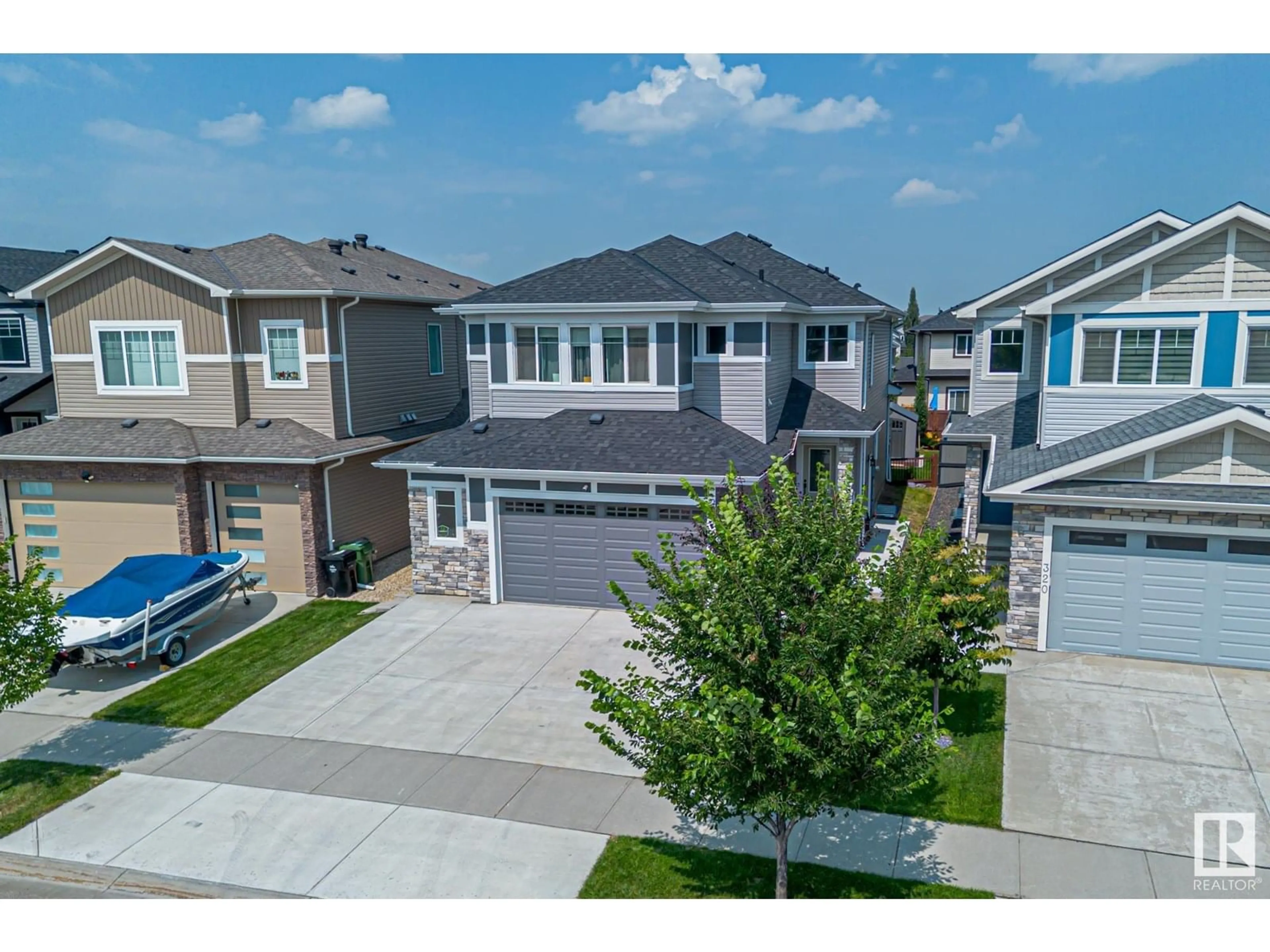 A pic from outside/outdoor area/front of a property/back of a property/a pic from drone, street for 318 HAVEN DR, Leduc Alberta T9E1B6