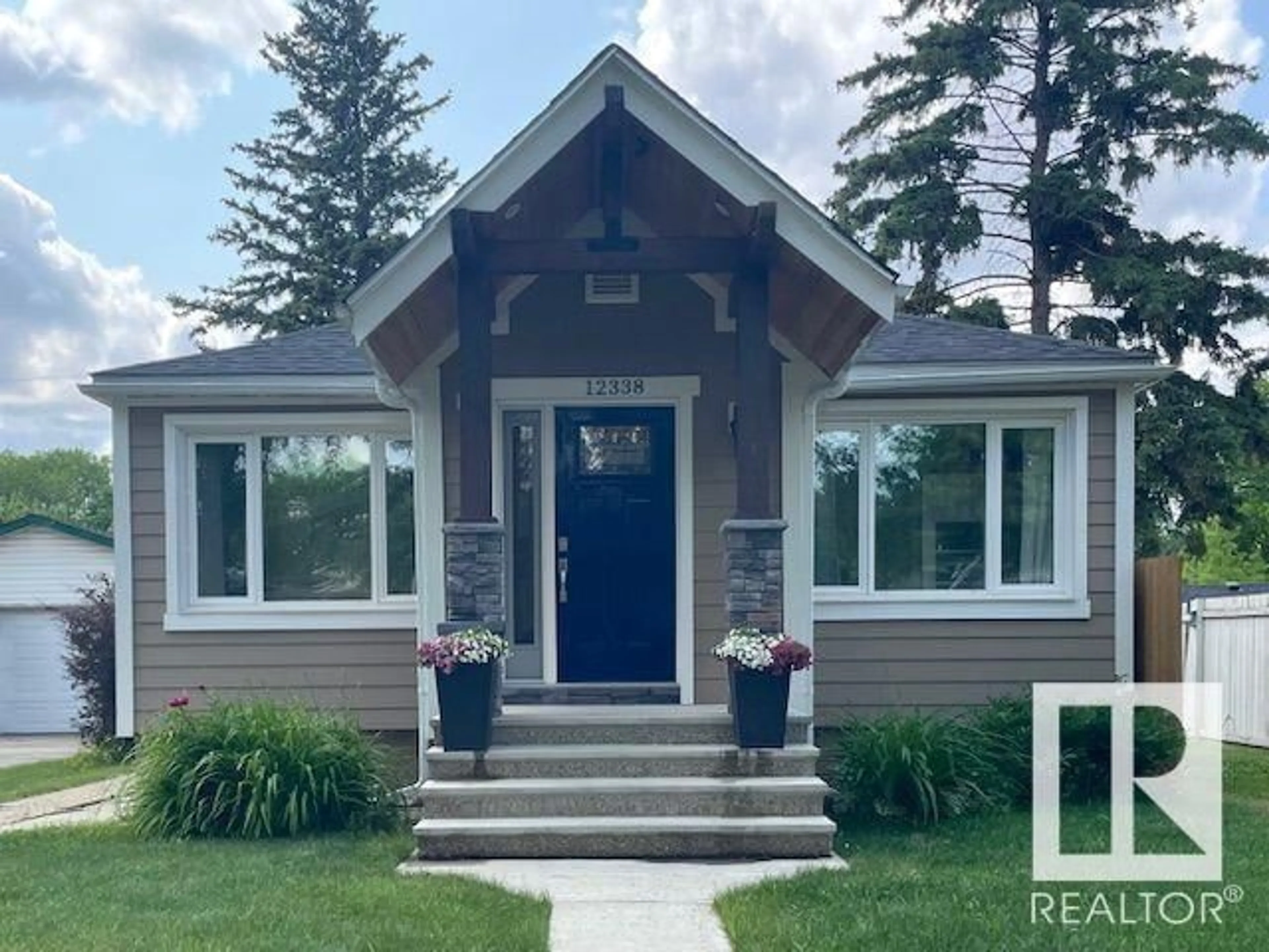 Home with vinyl exterior material, street for 12338 91 ST, Edmonton Alberta T5B4C5