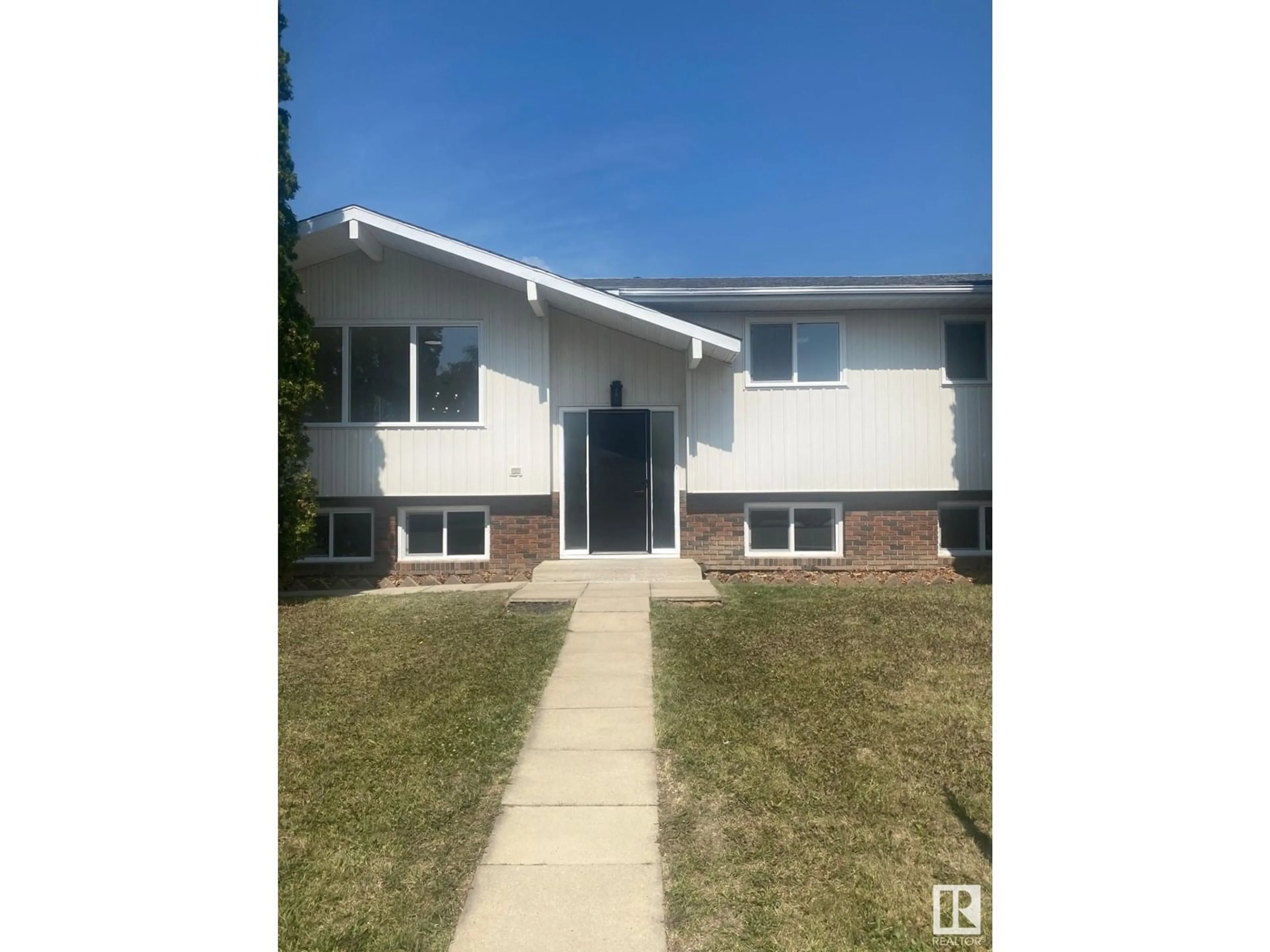 Home with vinyl exterior material, street for 11016 166 AVE, Edmonton Alberta T5X1Y3