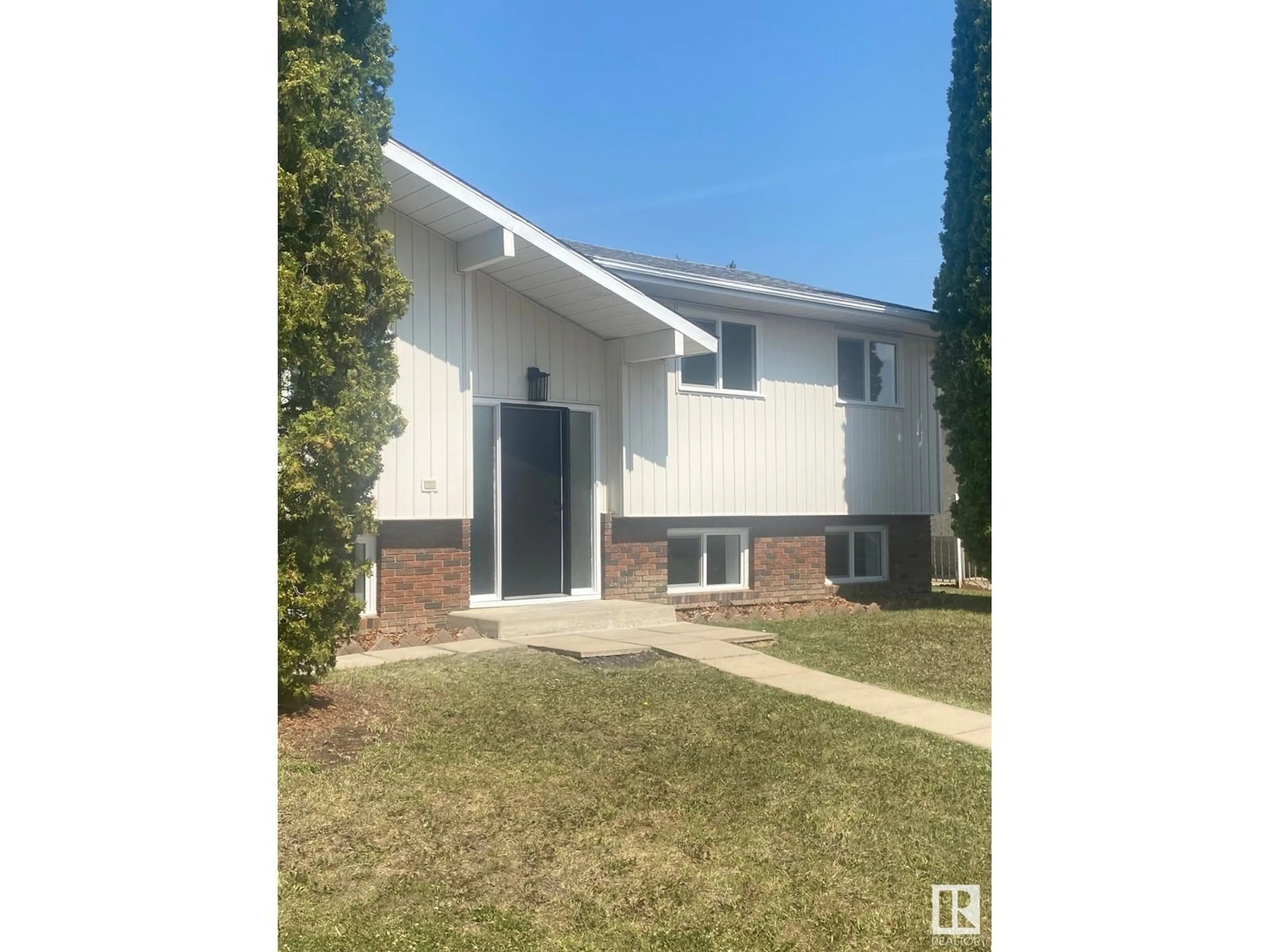 Home with vinyl exterior material, street for 11016 166 AVE, Edmonton Alberta T5X1Y3