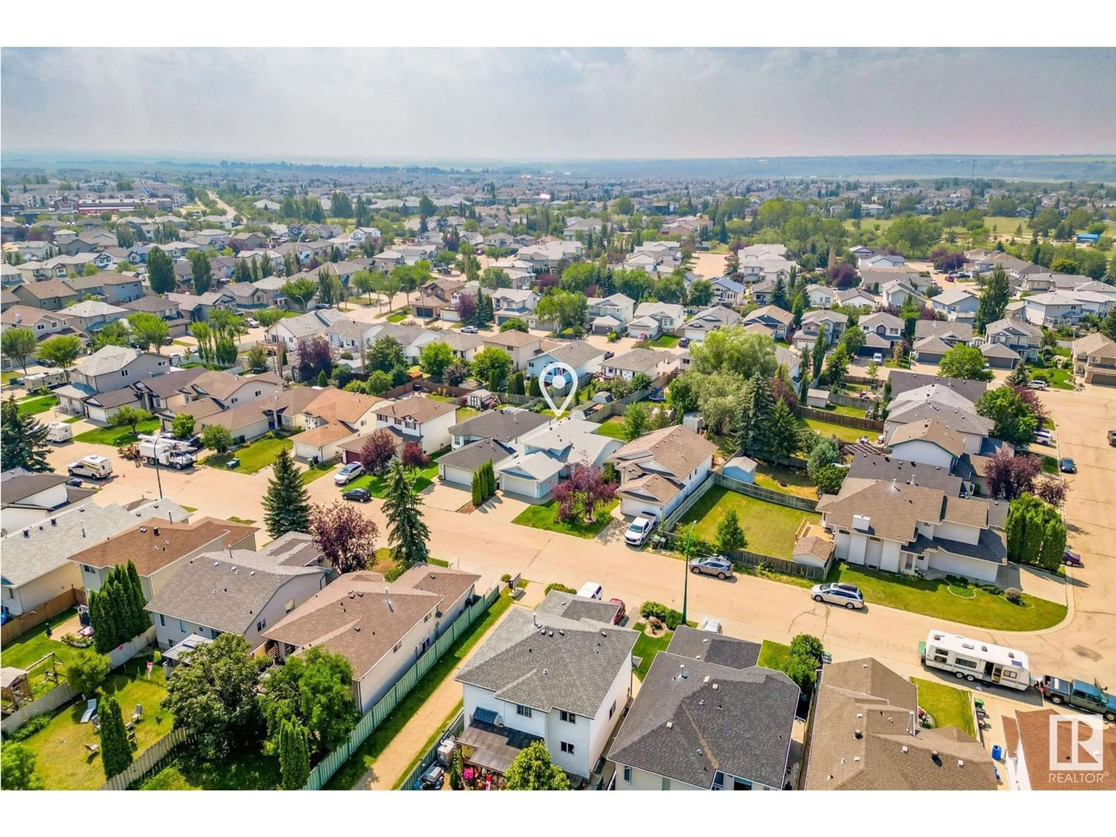 A pic from outside/outdoor area/front of a property/back of a property/a pic from drone, unknown for 53 WESTWOOD GR, Fort Saskatchewan Alberta T8L4G3
