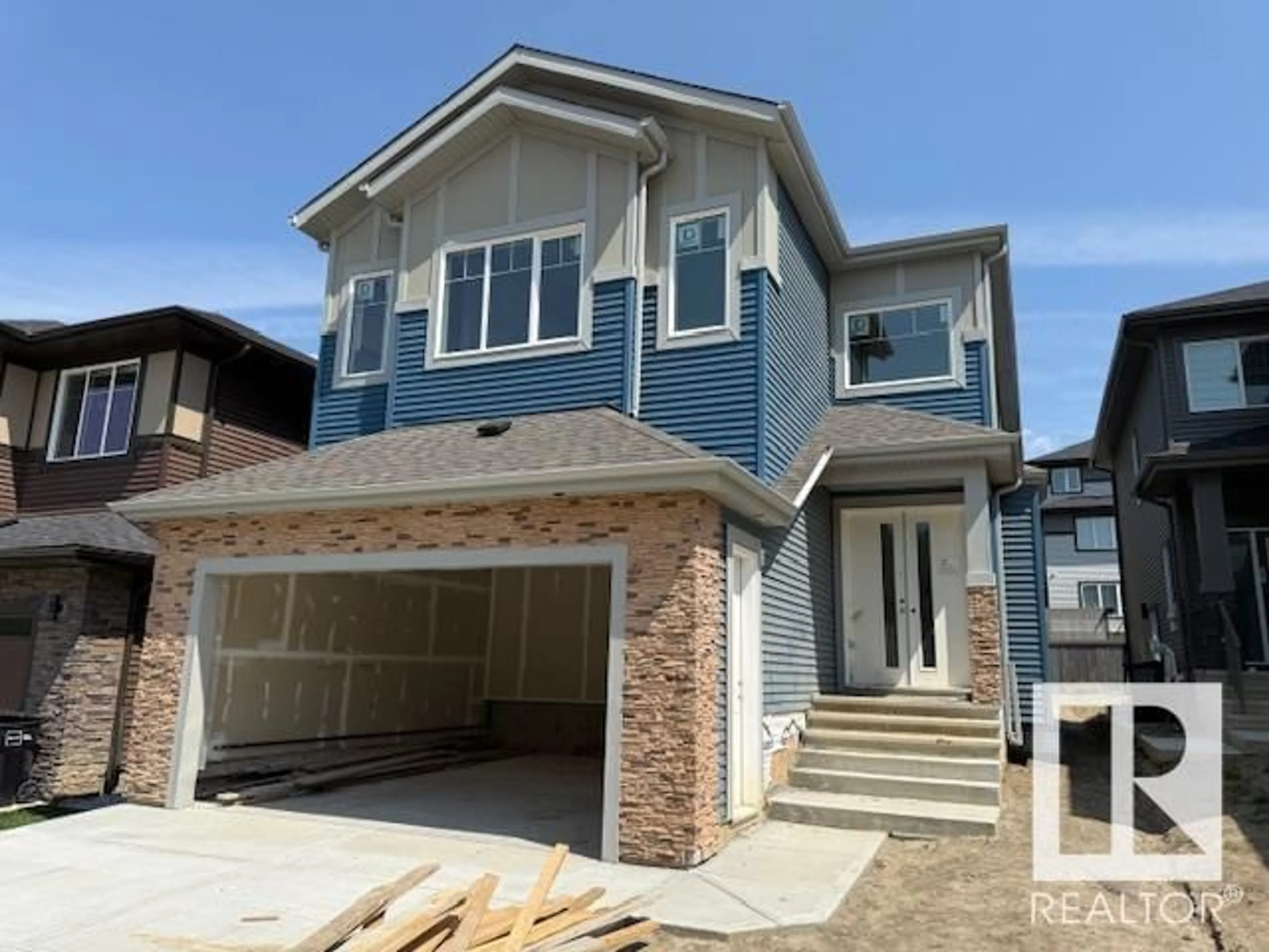 Home with vinyl exterior material, street for 1160 GYRFALCON CR, Edmonton Alberta T5S0S1
