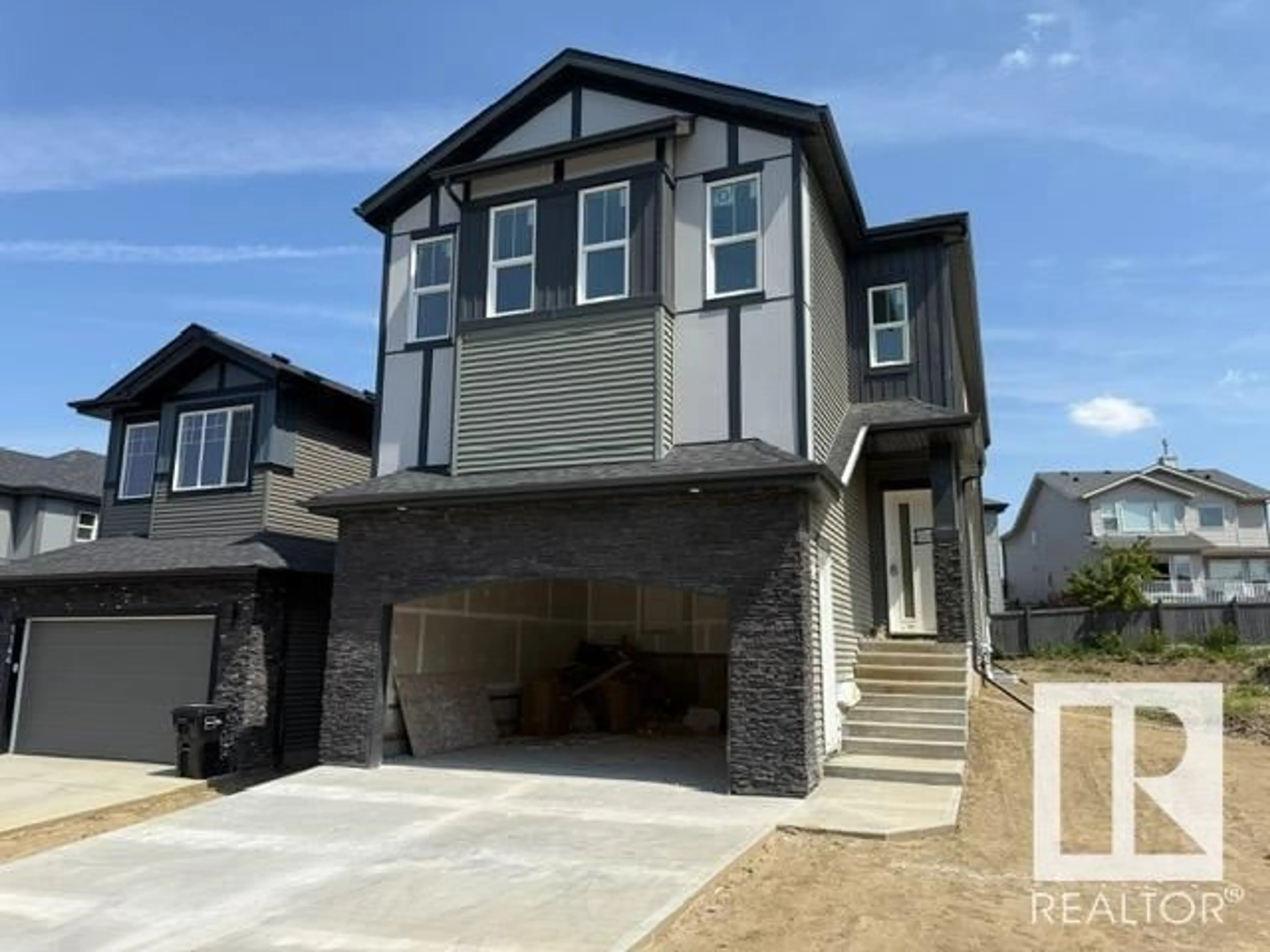 Home with vinyl exterior material, street for 1142 GYRFALCON CR, Edmonton Alberta T5S0S5