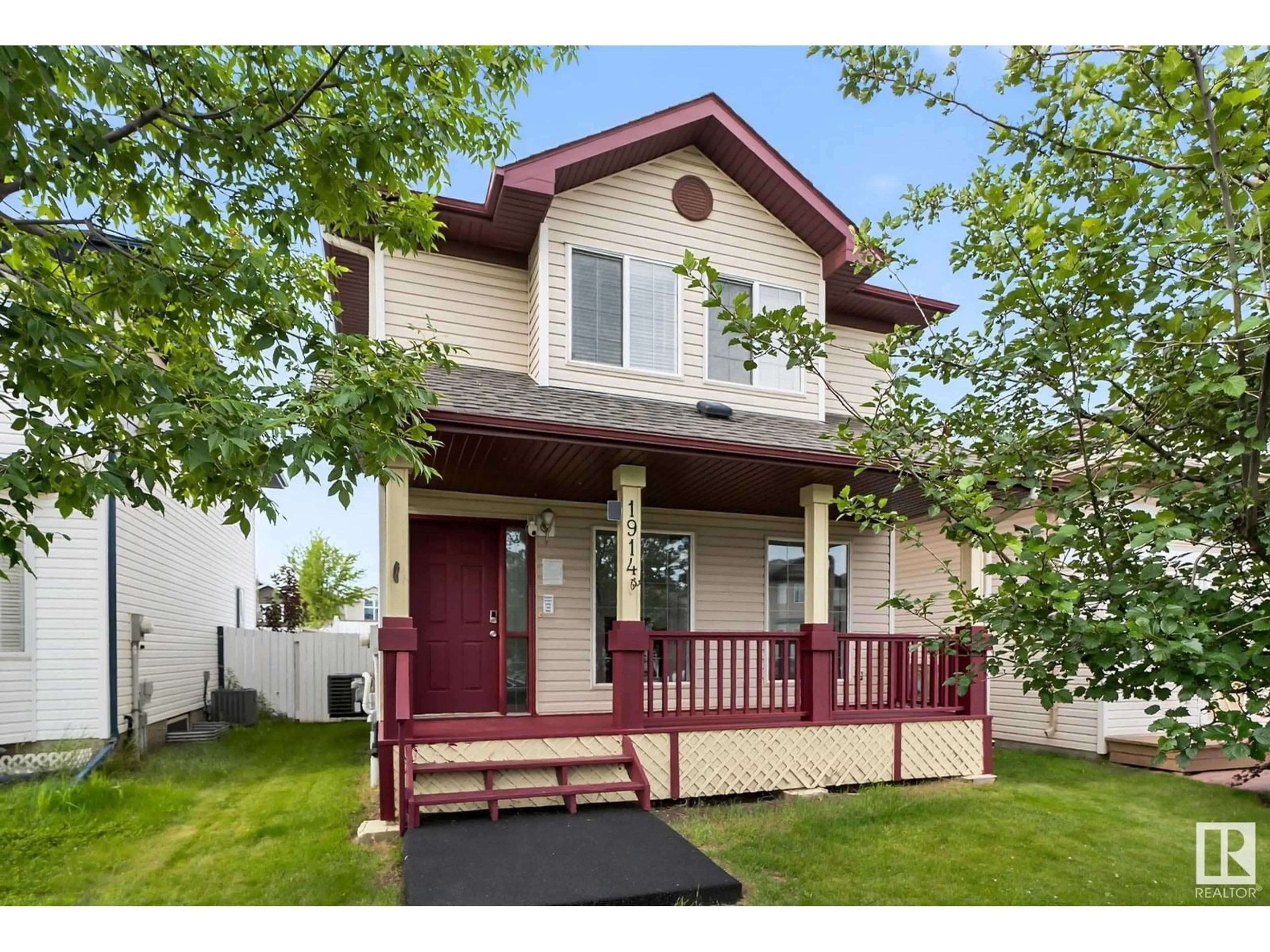 Home with vinyl exterior material, street for NW - 1914 37 AVE, Edmonton Alberta T6T1S7