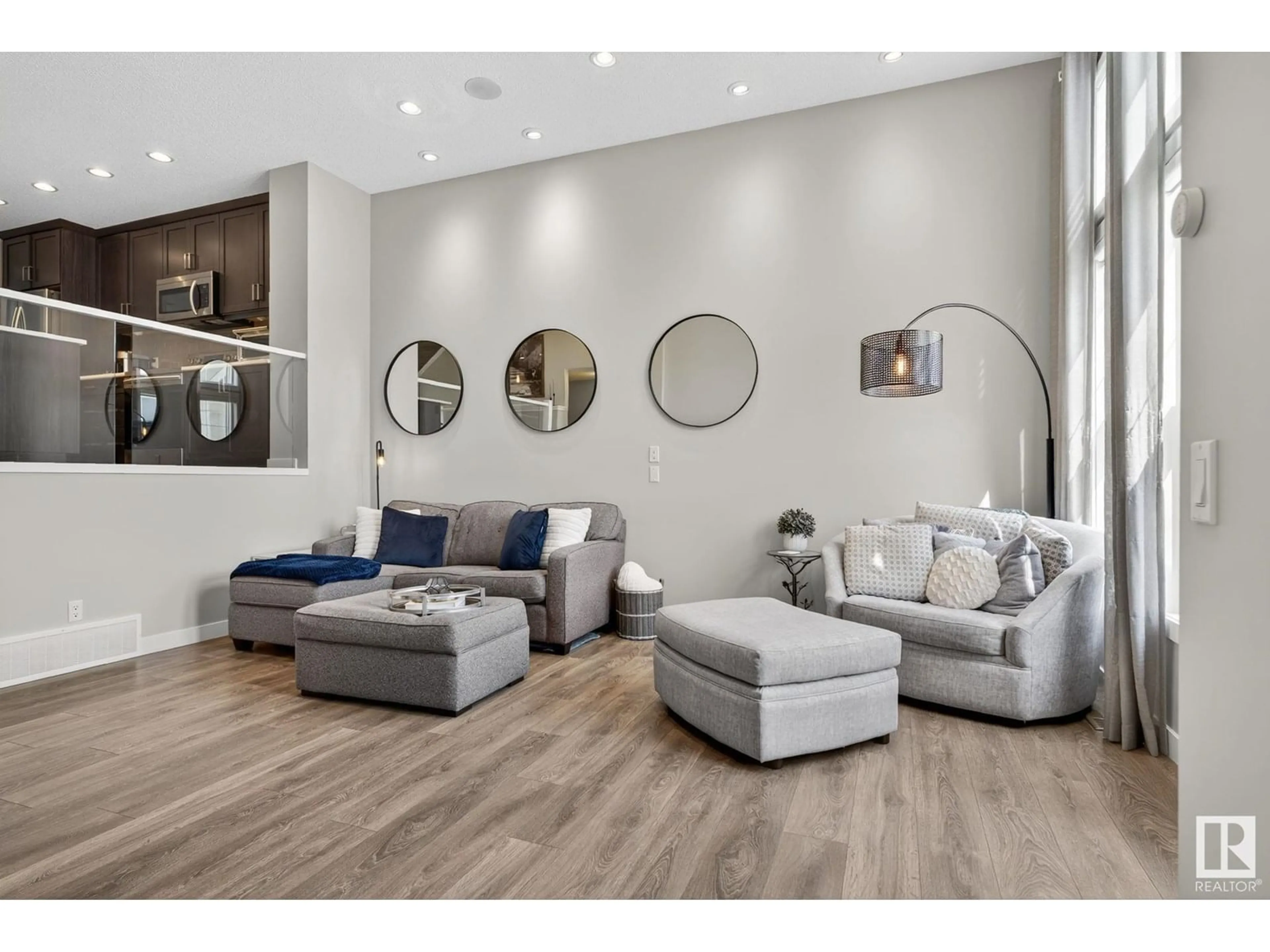 Living room with furniture, wood/laminate floor for 5074 ANDISON CL, Edmonton Alberta T6W3T4
