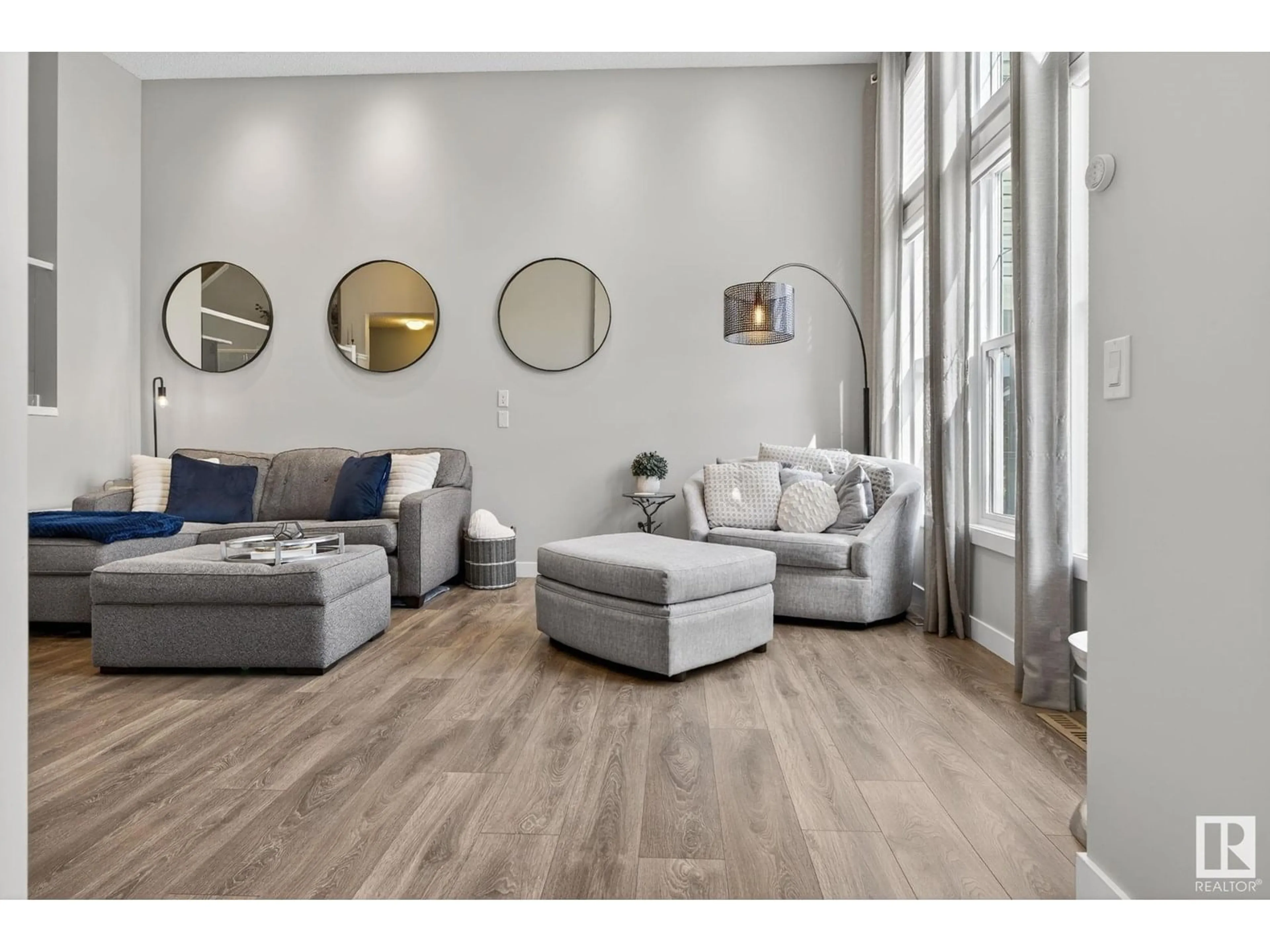 Living room with furniture, wood/laminate floor for 5074 ANDISON CL, Edmonton Alberta T6W3T4