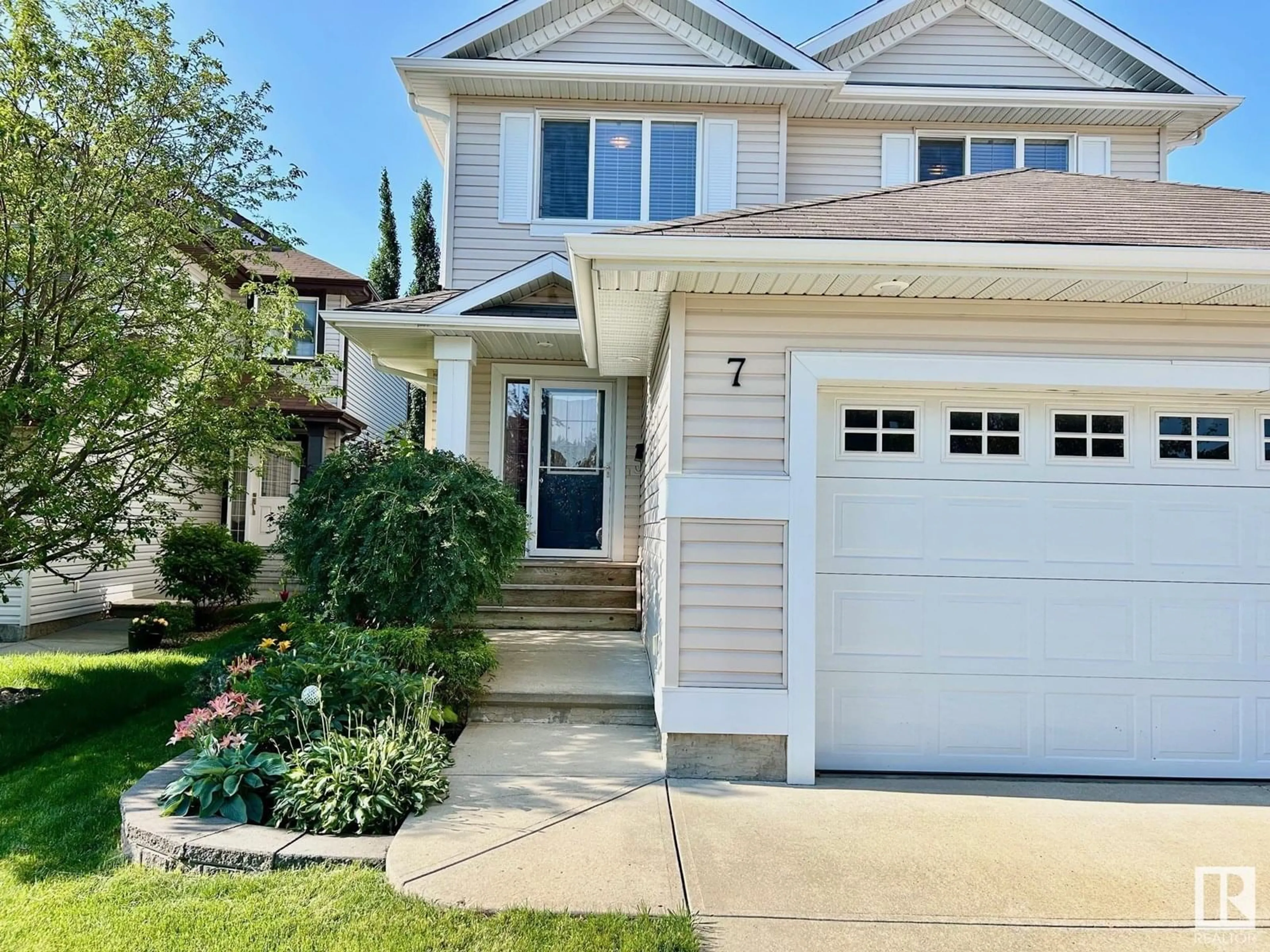 Home with vinyl exterior material, street for 7 BAIE MADELENE, Beaumont Alberta T4X0E8