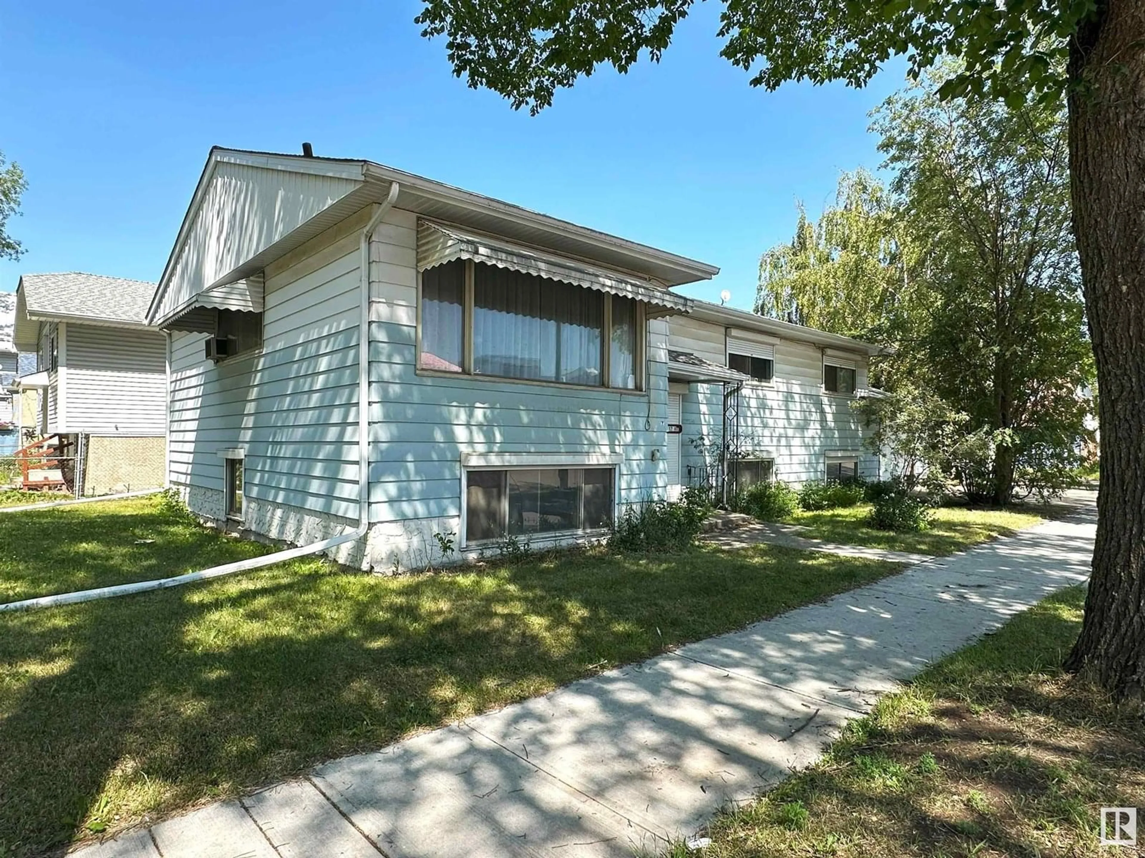 Home with vinyl exterior material, street for 9108 112 AV, Edmonton Alberta T5B0H3