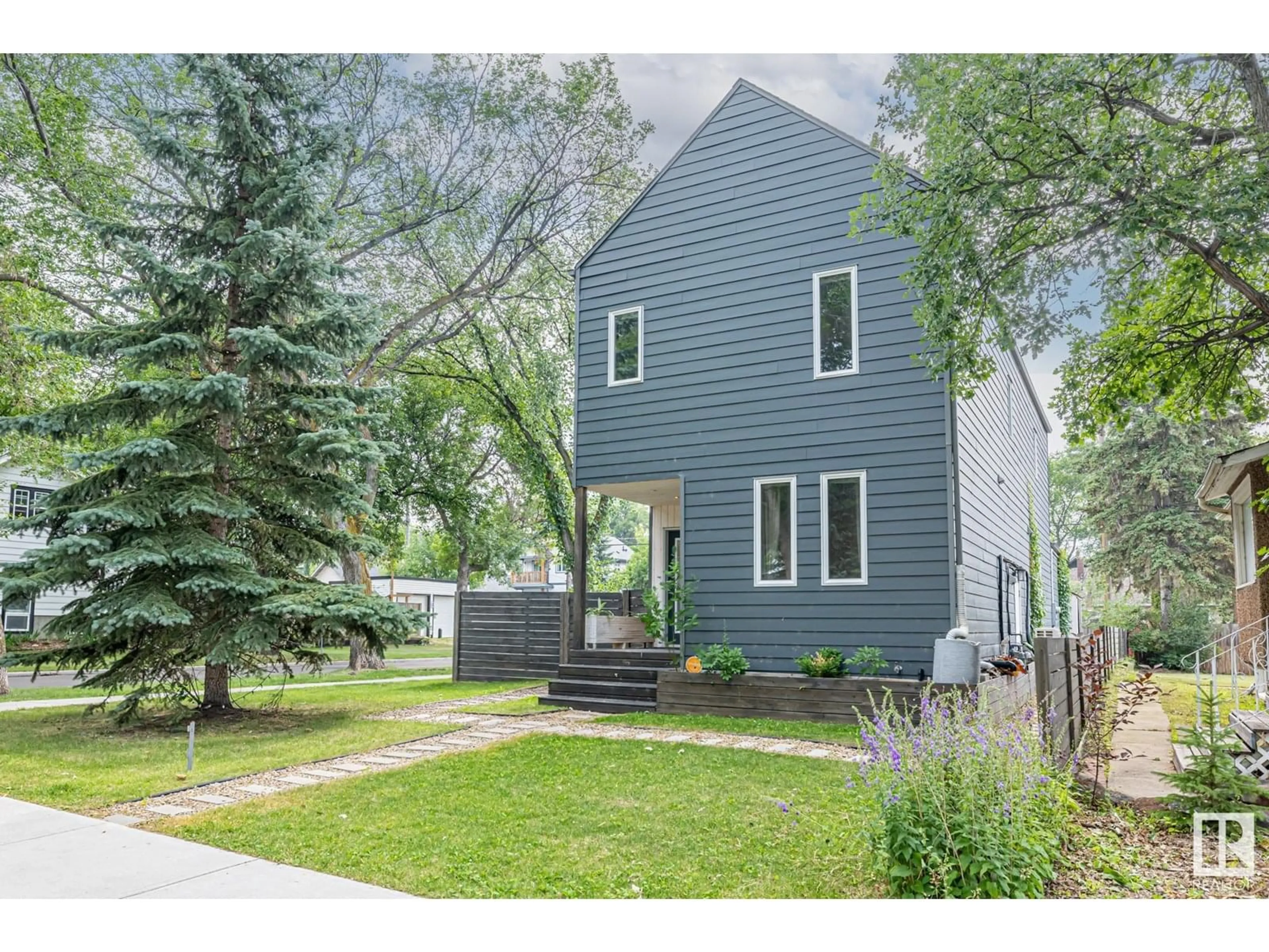 Home with vinyl exterior material, street for NW - 11402 66 ST, Edmonton Alberta T5B1H8