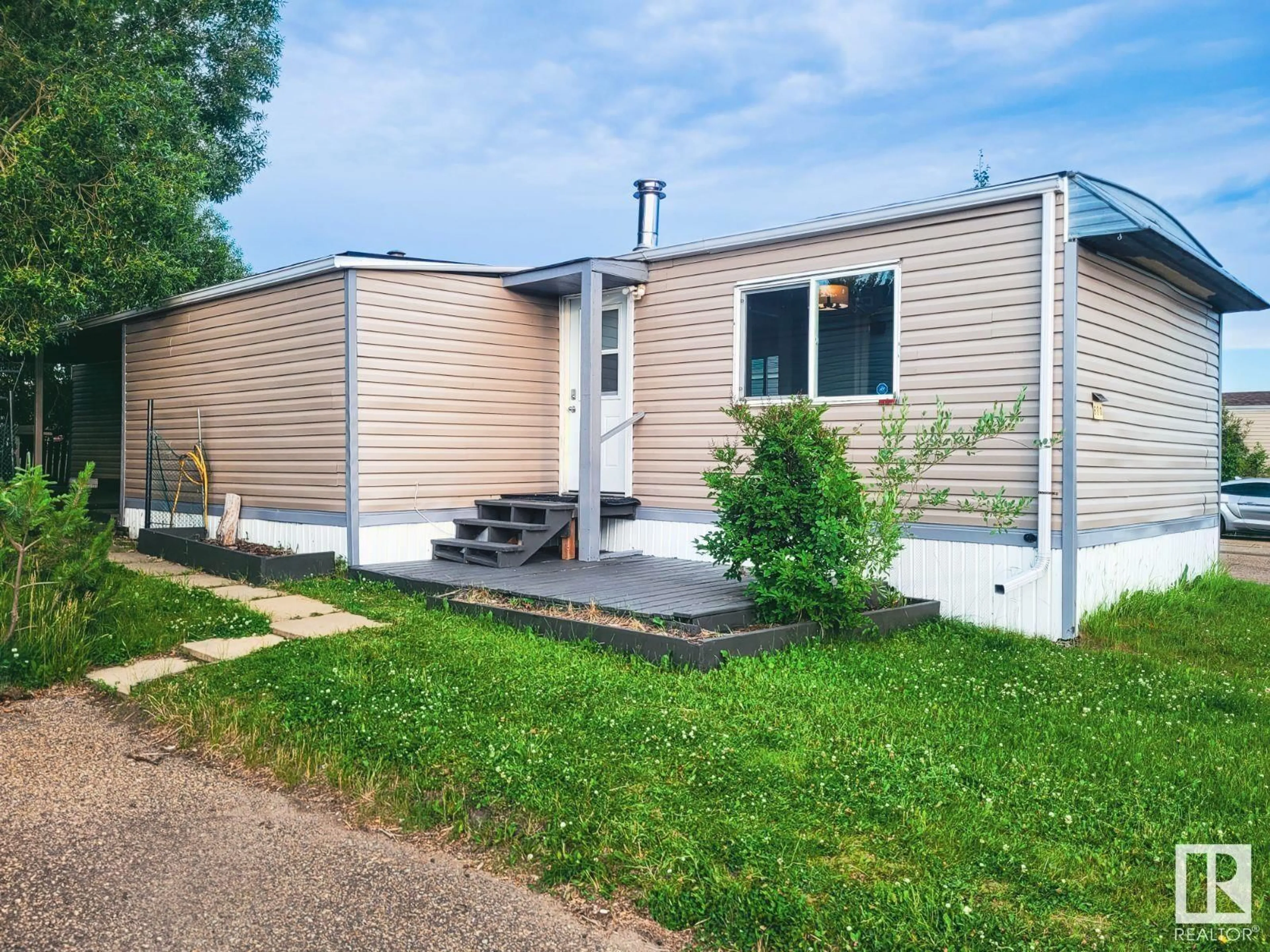 Home with vinyl exterior material, street for 680 53222 RGE ROAD 272, Rural Parkland County Alberta T7X3N4