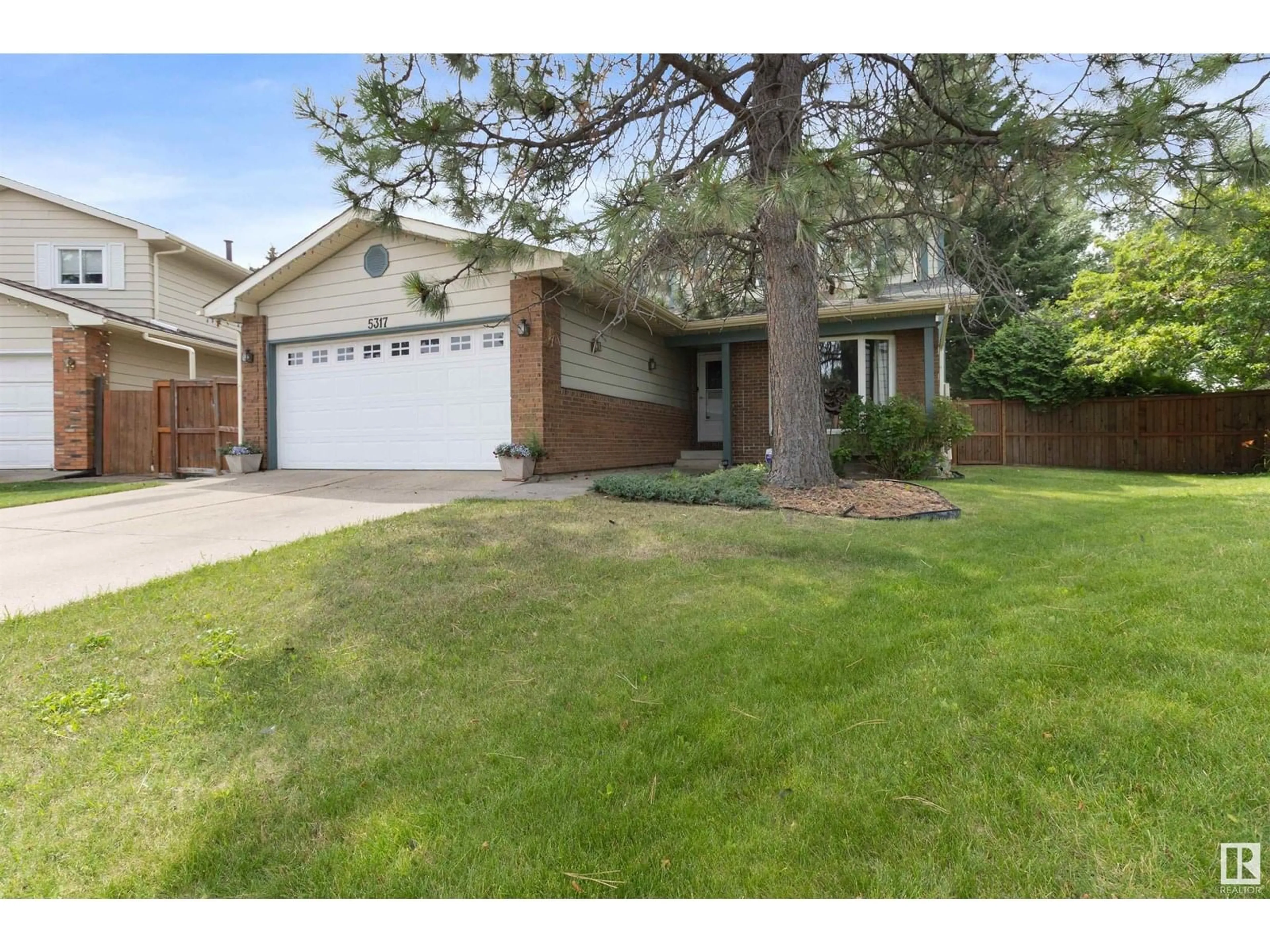 Home with brick exterior material, street for 5317 38A AV NW, Edmonton Alberta T6L2J4