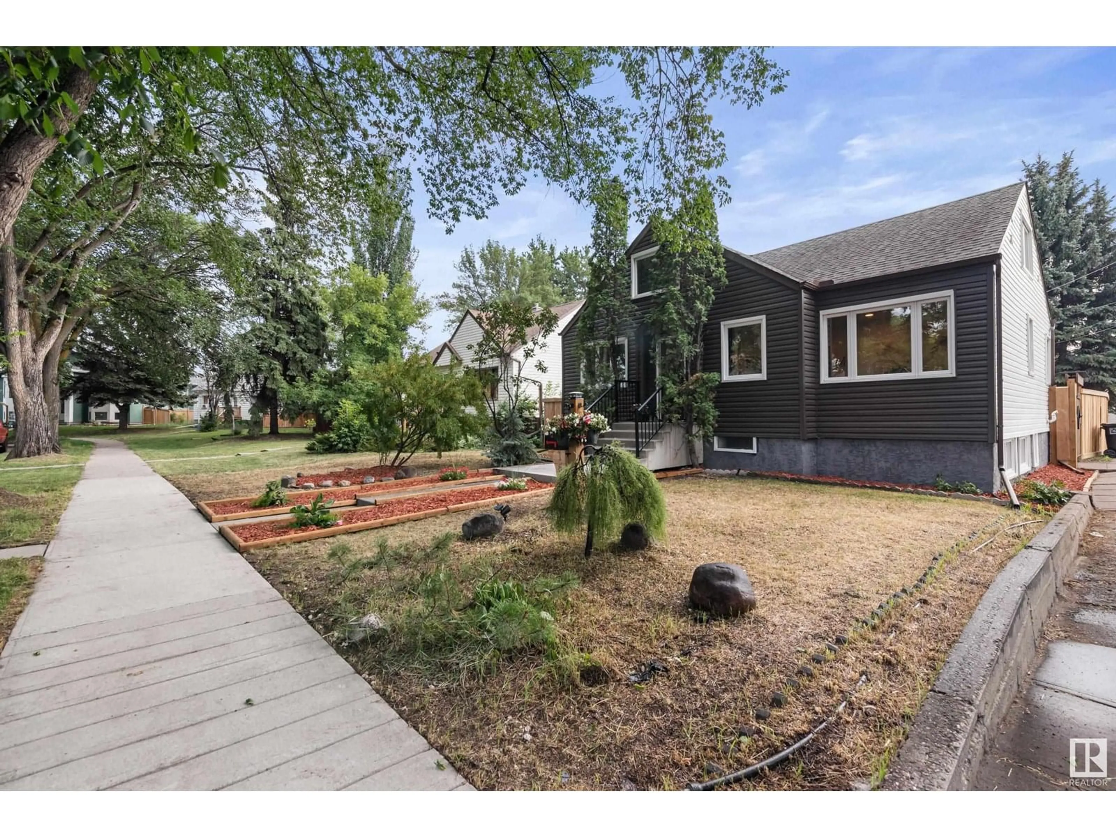 A pic from outside/outdoor area/front of a property/back of a property/a pic from drone, street for 12815 119 AV, Edmonton Alberta T5L2N1