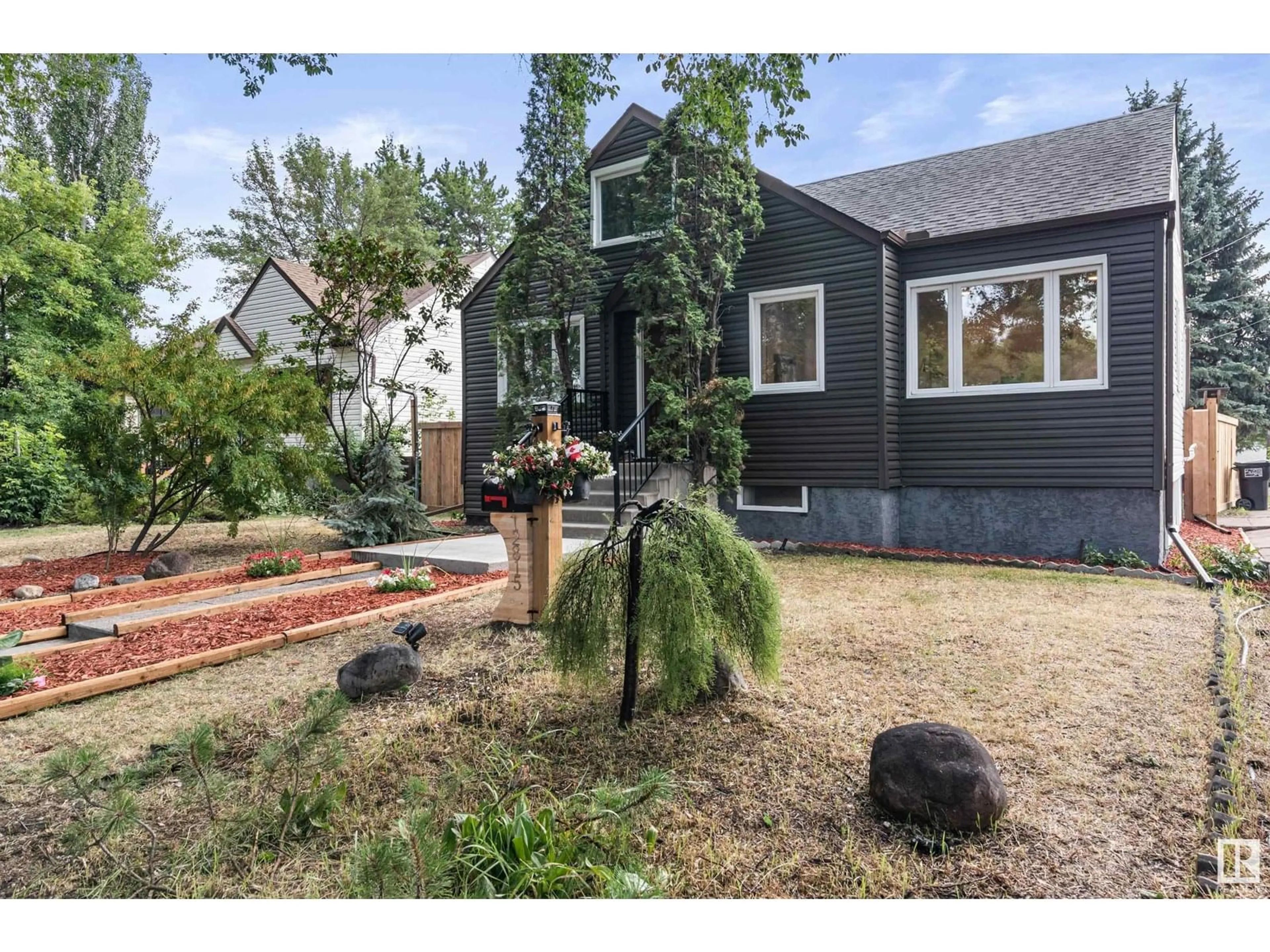 Home with brick exterior material, street for 12815 119 AV, Edmonton Alberta T5L2N1