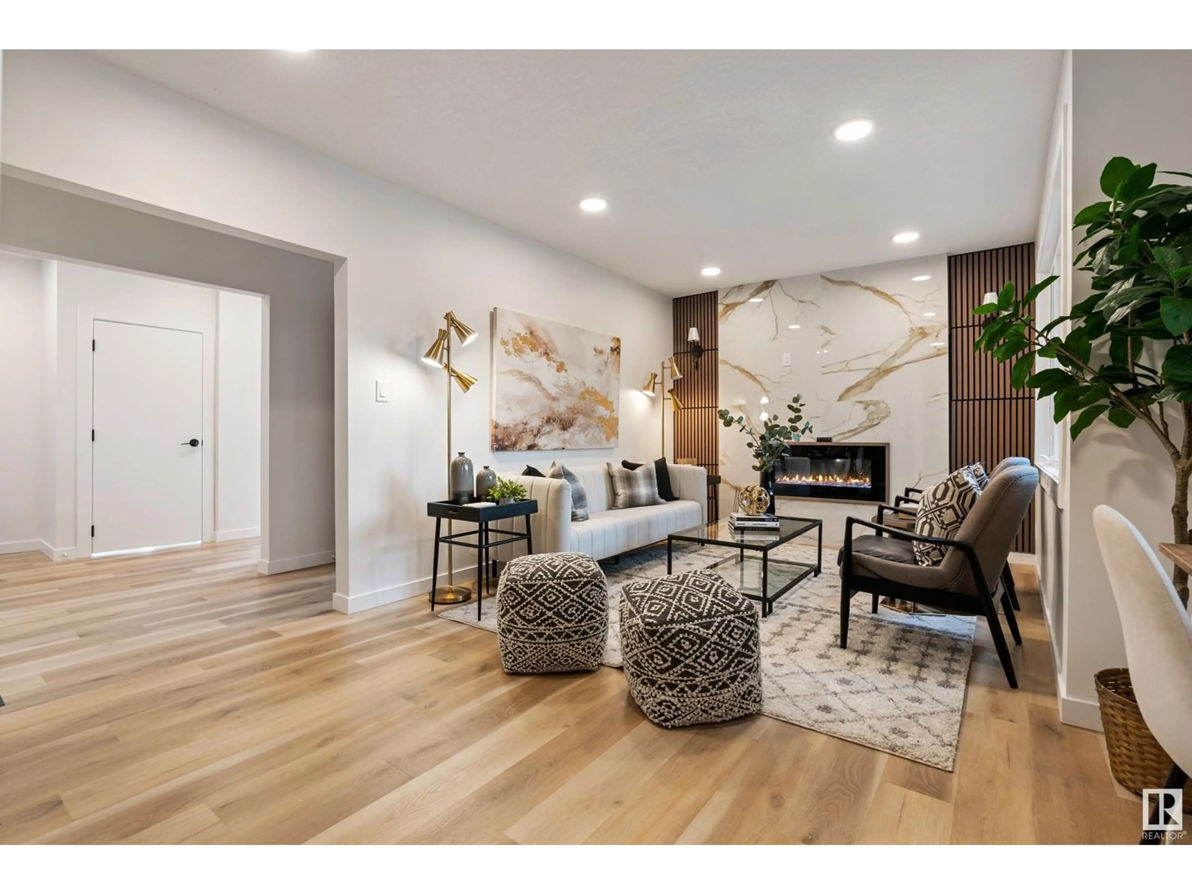 Living room with furniture, wood/laminate floor for 12815 119 AV, Edmonton Alberta T5L2N1