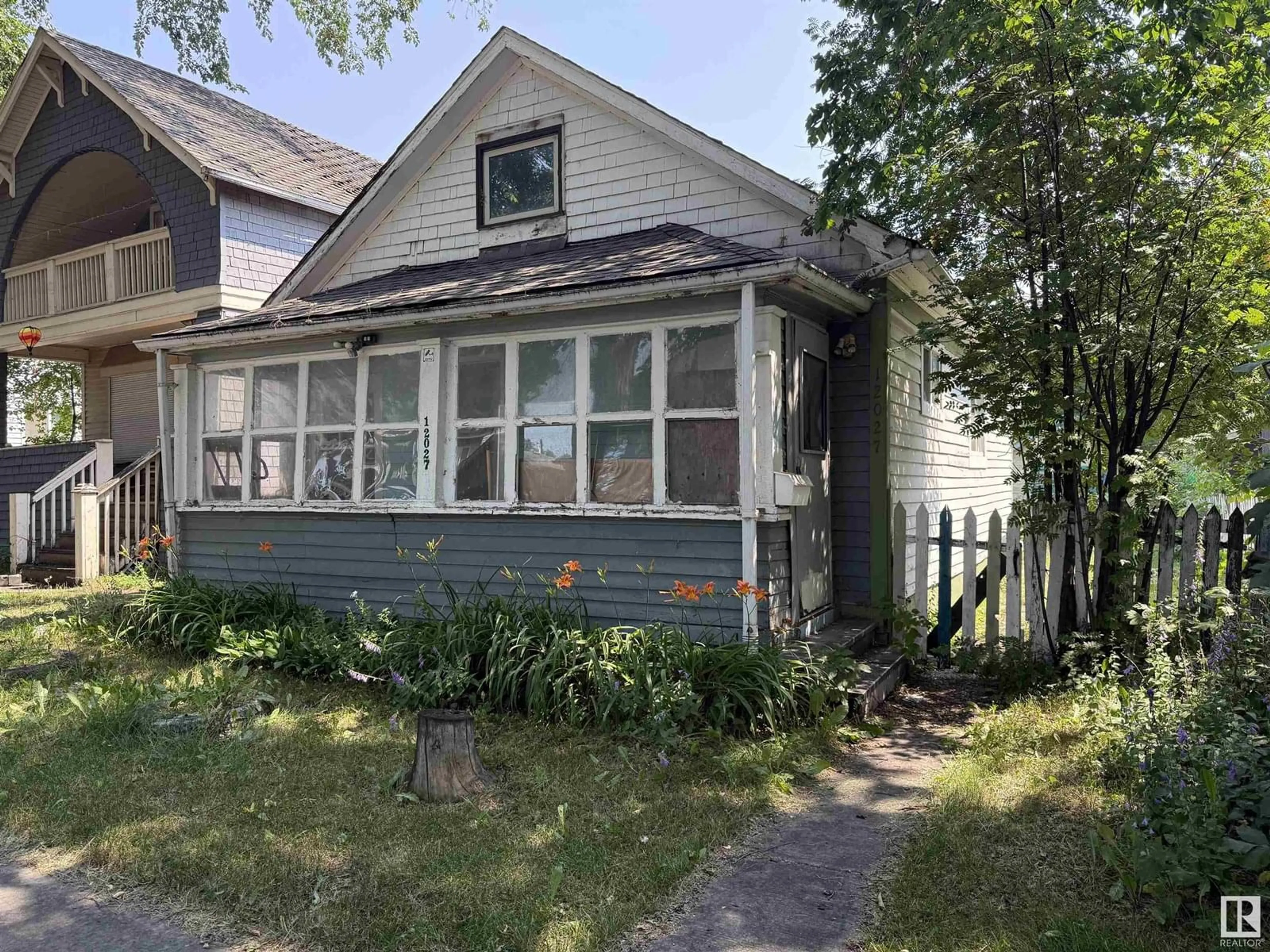 Home with vinyl exterior material, street for 12027 93 ST, Edmonton Alberta T5G1E7