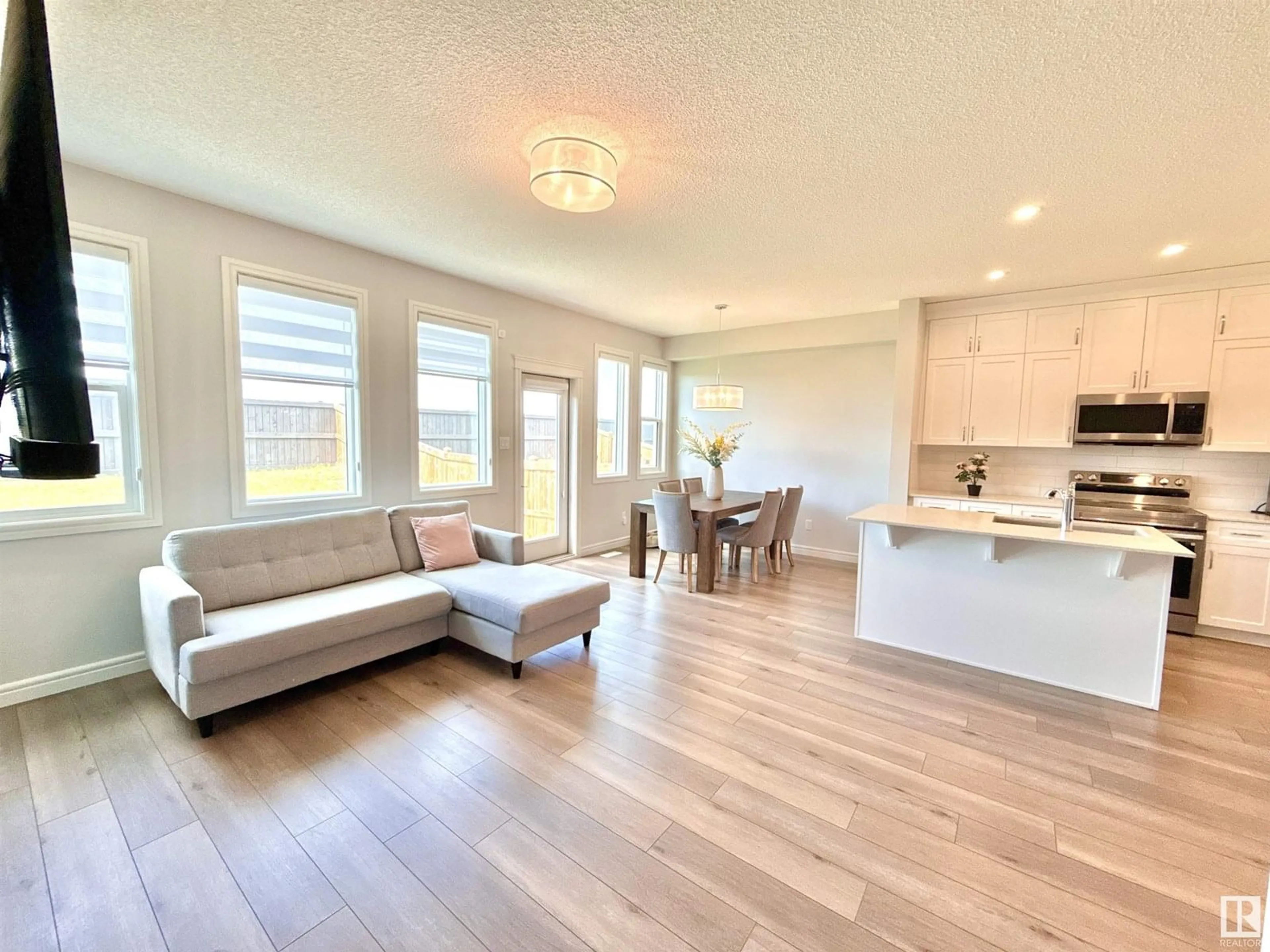 Open concept kitchen, wood/laminate floor for 17520 49 ST, Edmonton Alberta T5Y4C6