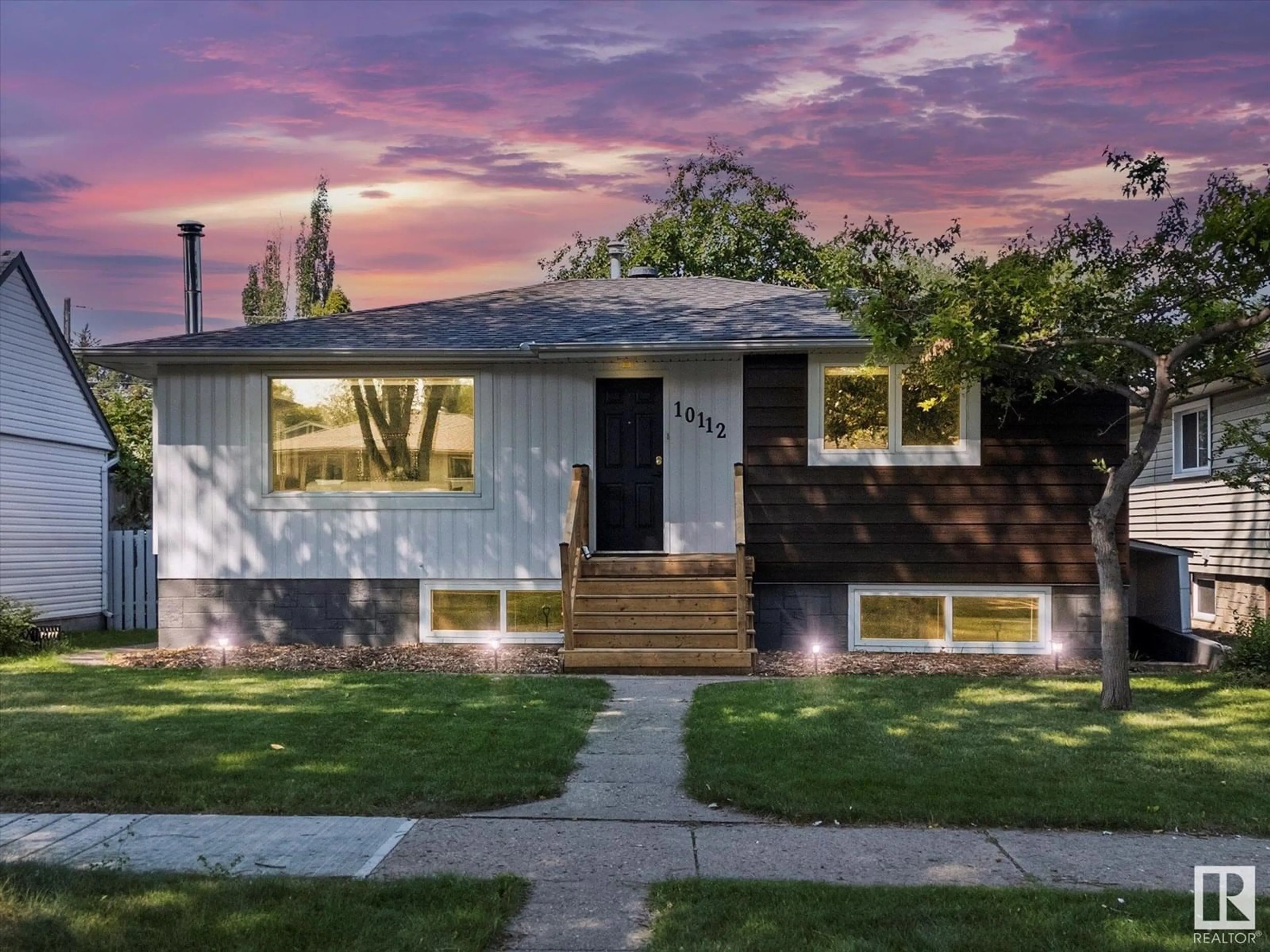 Home with vinyl exterior material, street for NW - 10112 81 ST, Edmonton Alberta T6A3K5