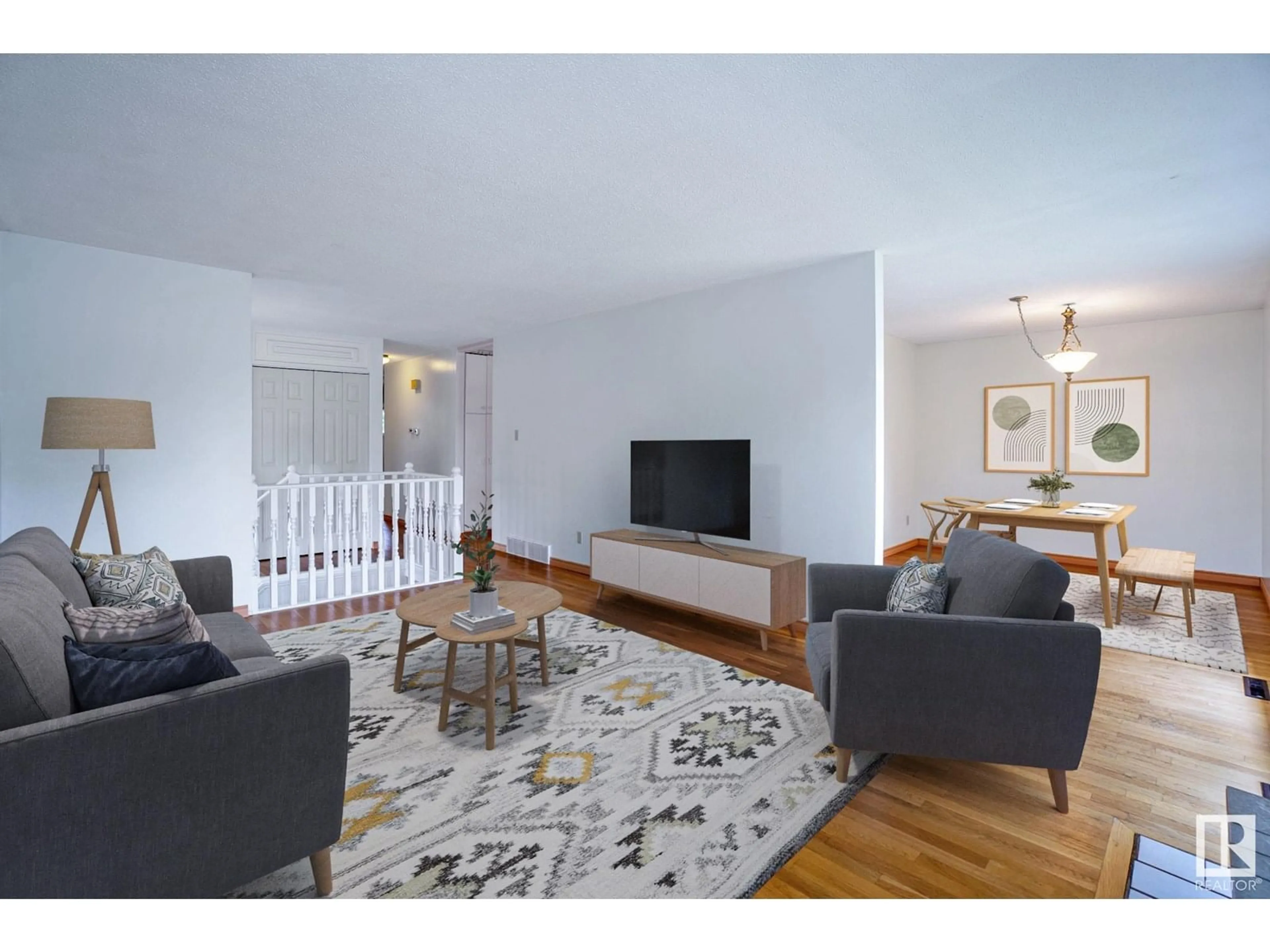 Living room with furniture, wood/laminate floor for NW - 4051 120 ST, Edmonton Alberta T6J1X7