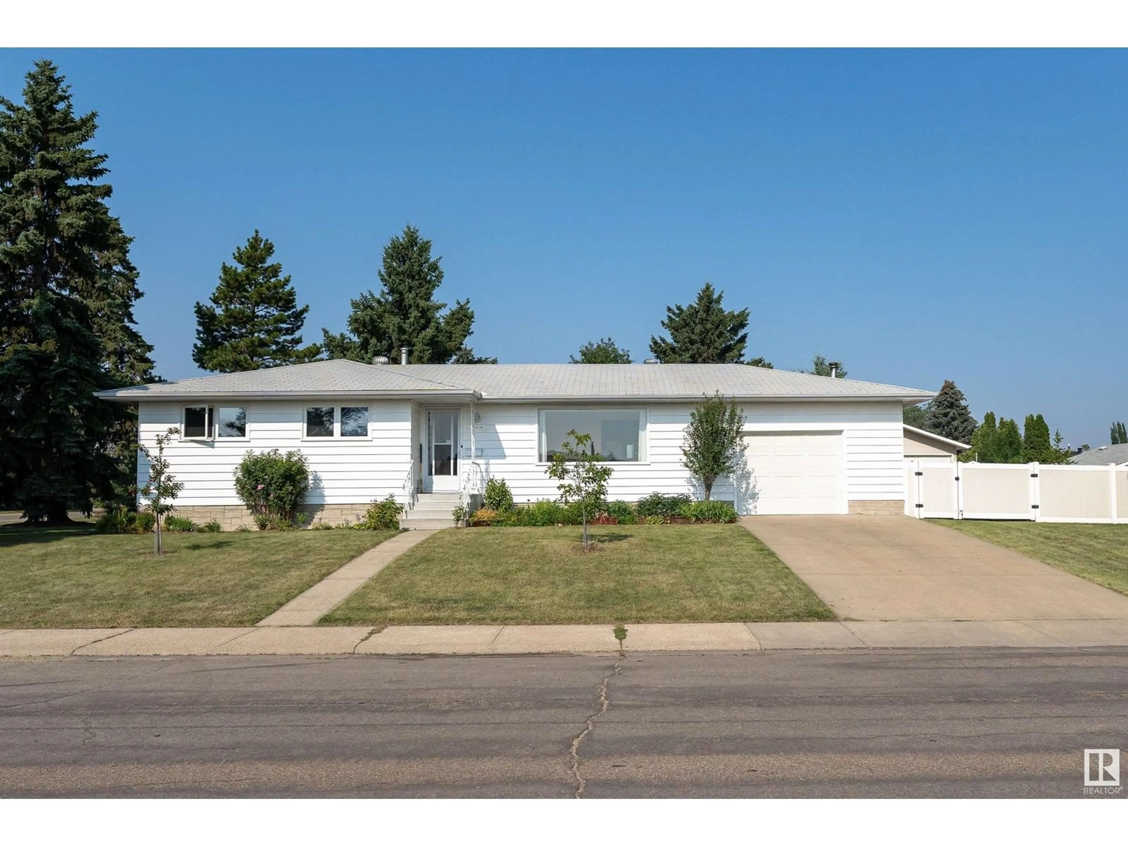Home with vinyl exterior material, street for 10404 34 ST, Edmonton Alberta T5W1X9